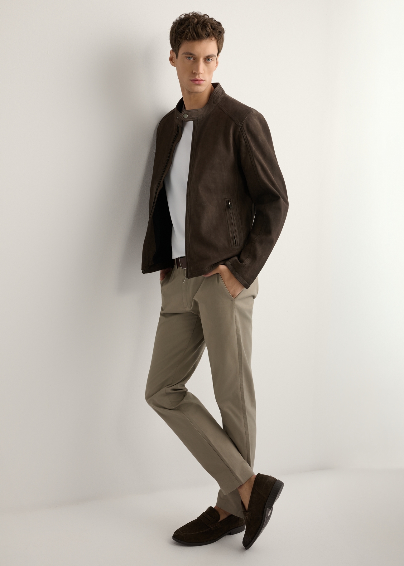 Brown men's suede jacket KURMS-0396-1I(W26) - side view of the product, on a model, against a light background. Full silhouette visible.