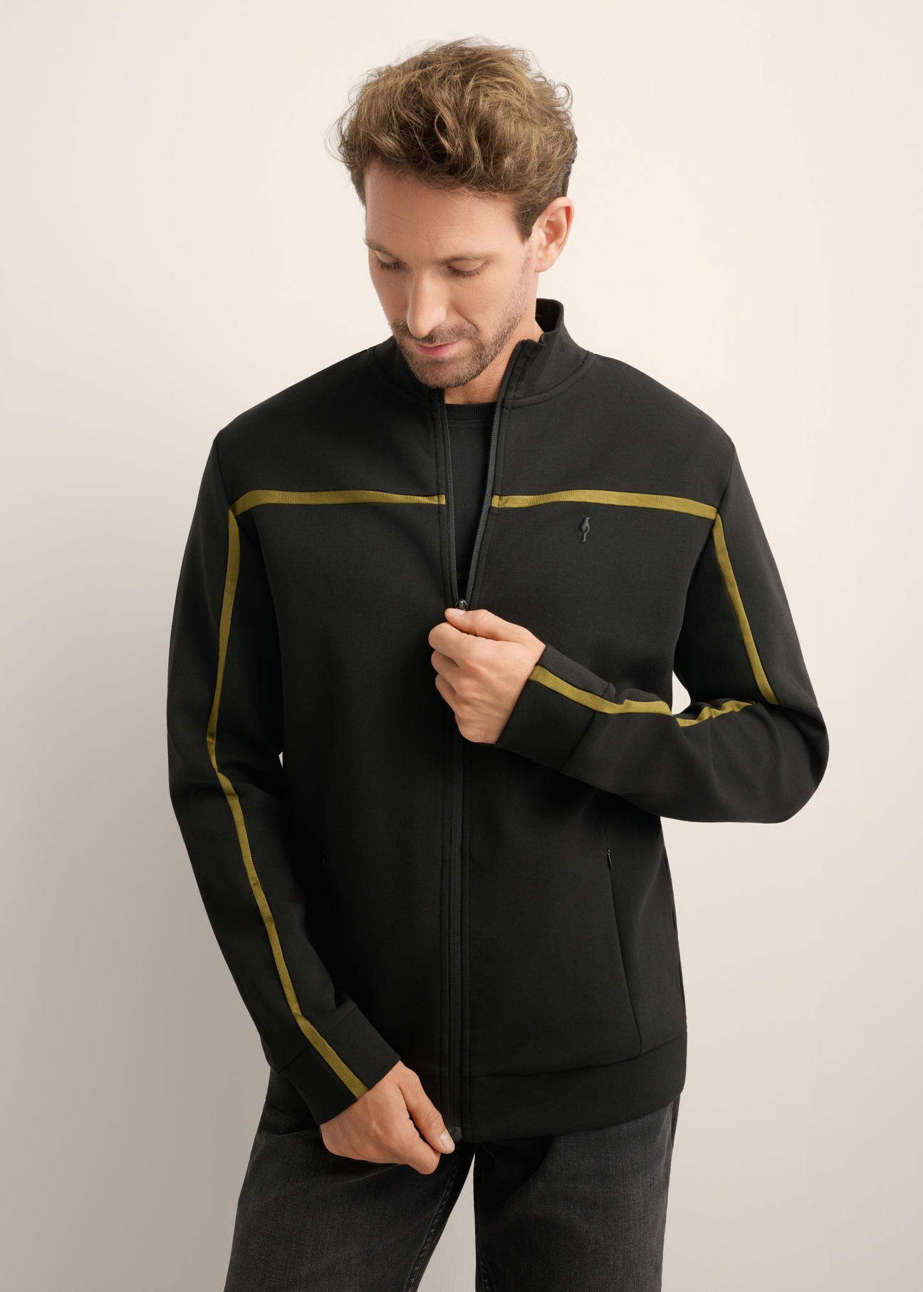 Men's black zip-up sweatshirt with stand-up collar BLZMT-0082-99(Z26), front view of the product on the model. Half of the silhouette visible.
