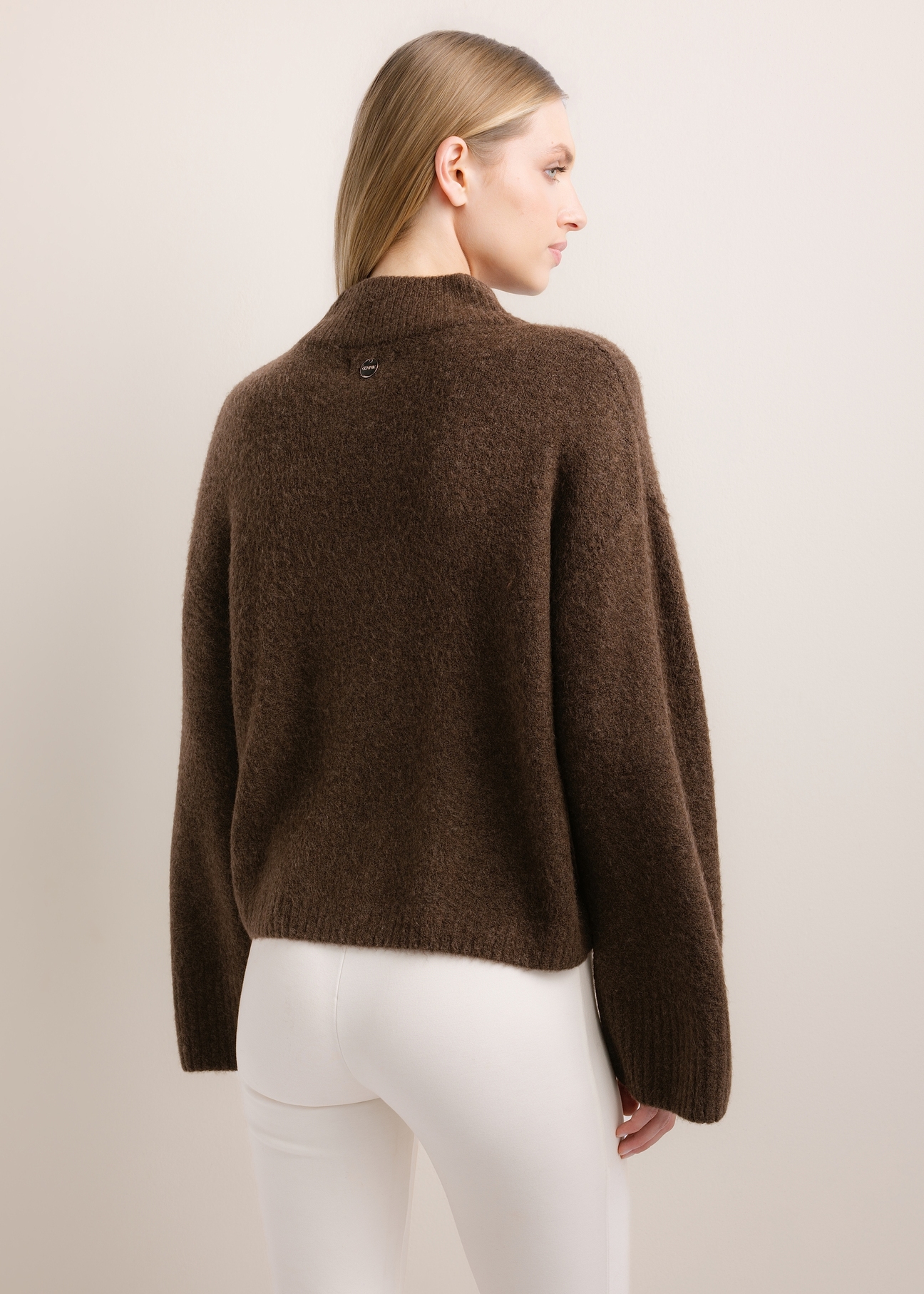 Dark brown oversized women's sweater SWEDT-0270-1I(Z26), product view from the back on the model. Half of the silhouette visible.