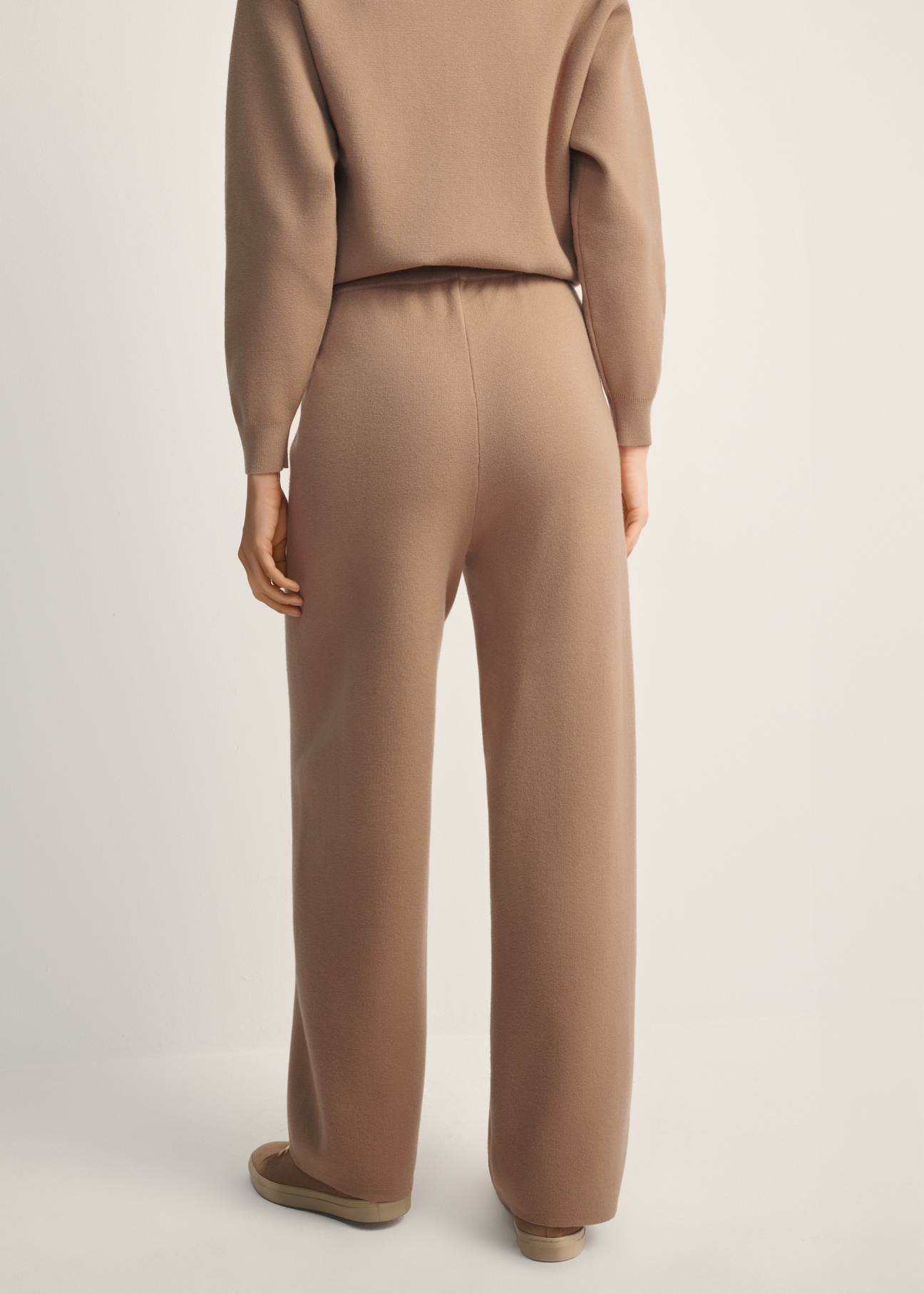 Women's camel viscose trousers SPODT-0116-24(Z25), back view of the product on the model. Half of the silhouette visible.