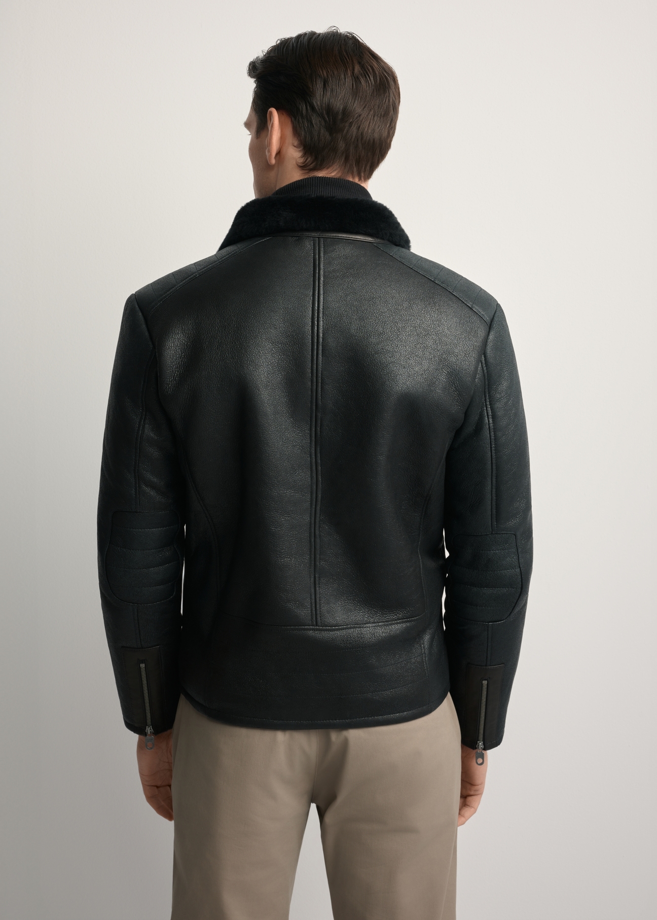 Men's sheepskin coat KOZMS-0001-1161(Z25), back view of the product on the model. Half of the silhouette visible.