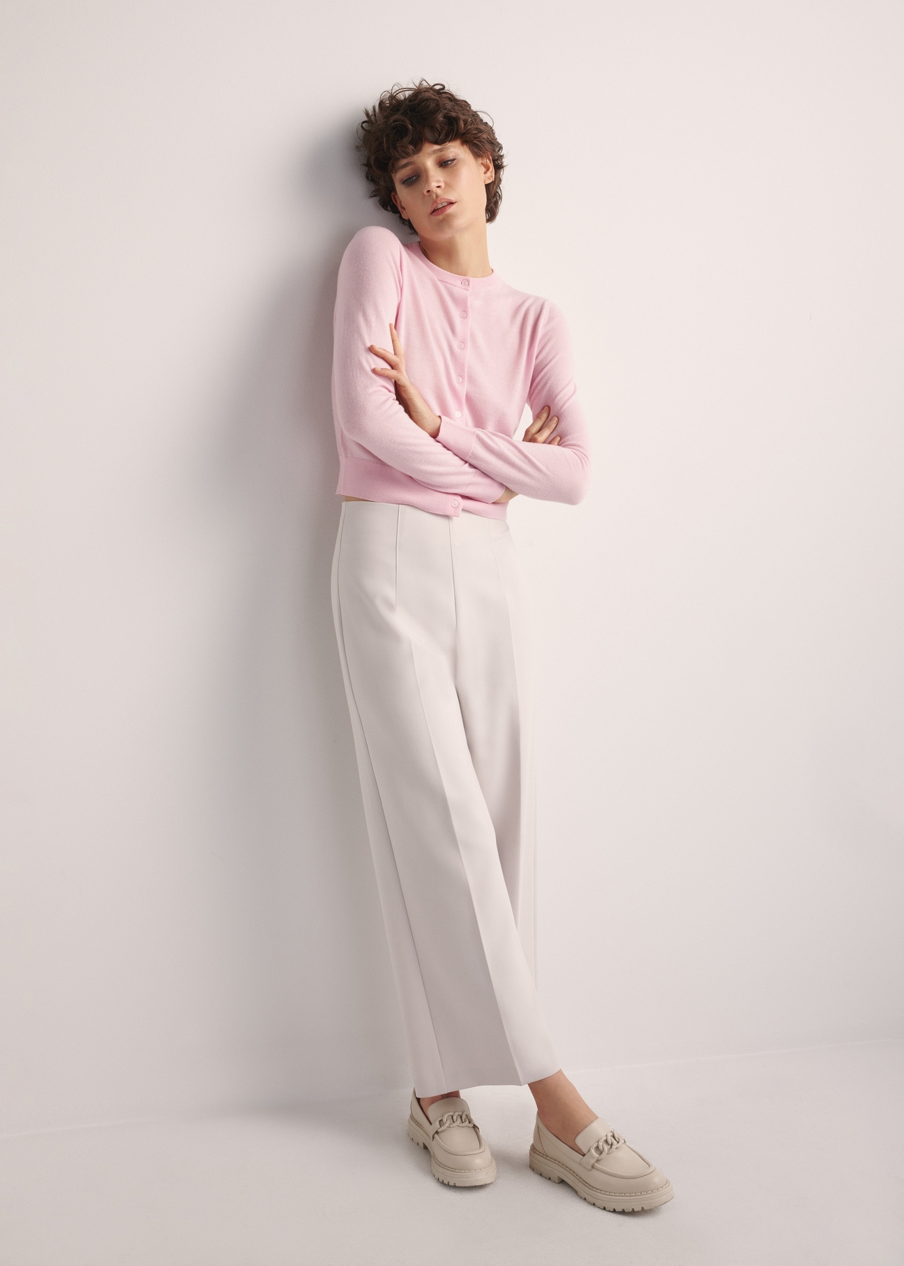 Women's woolen cardigan KARDT-0057-34(Z25), product photo from the front on a model, the entire silhouette is visible.