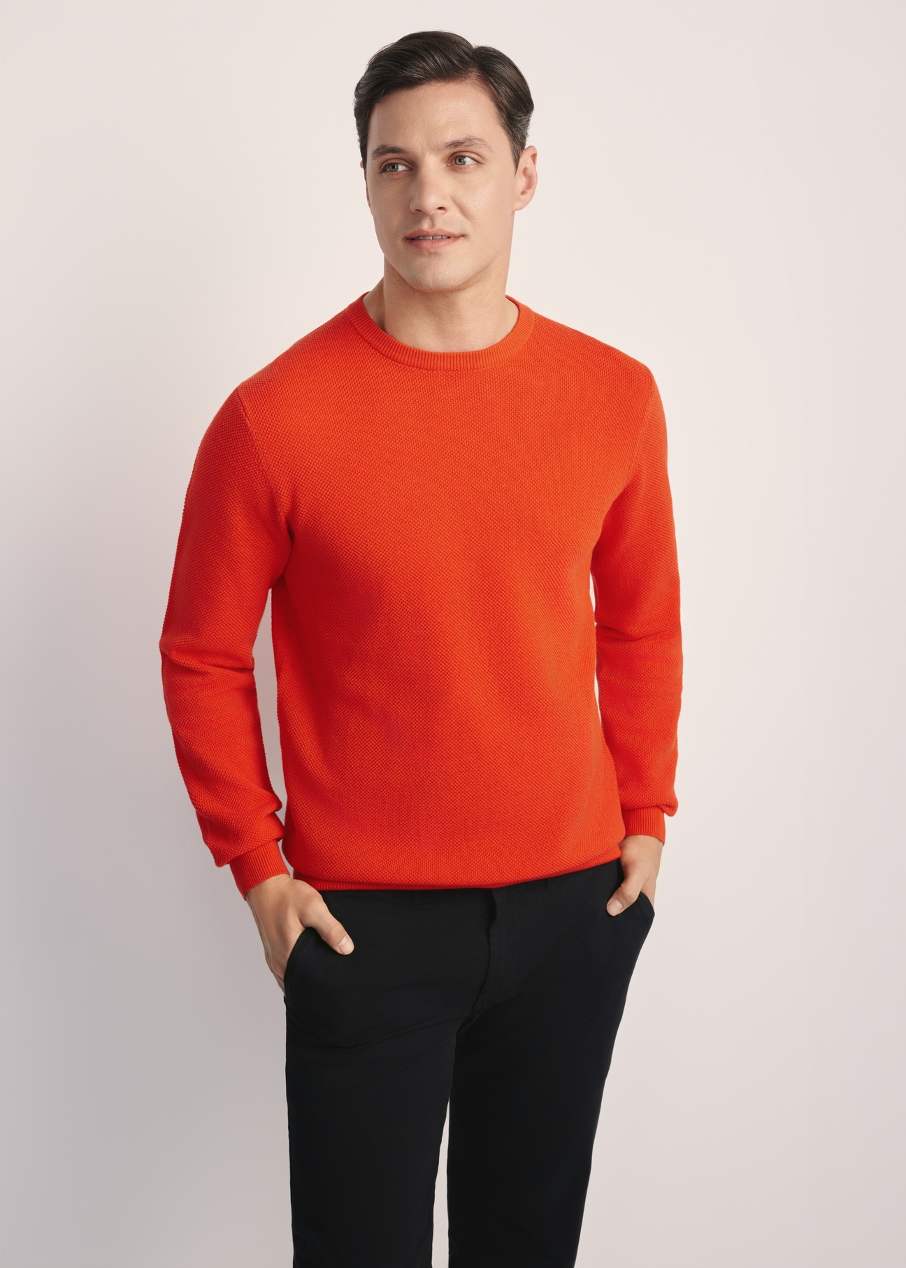 Orange men's sweater SWEMT-0181-30(Z25), front product view on the model. Half of the silhouette visible.