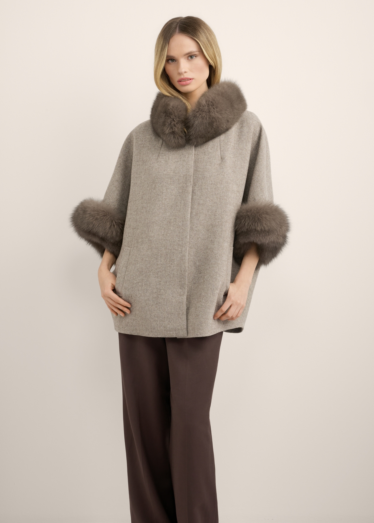 Wool vest with fur KAMDW-0002-1A(Z26), front view of the product on the model. Half of the silhouette visible.