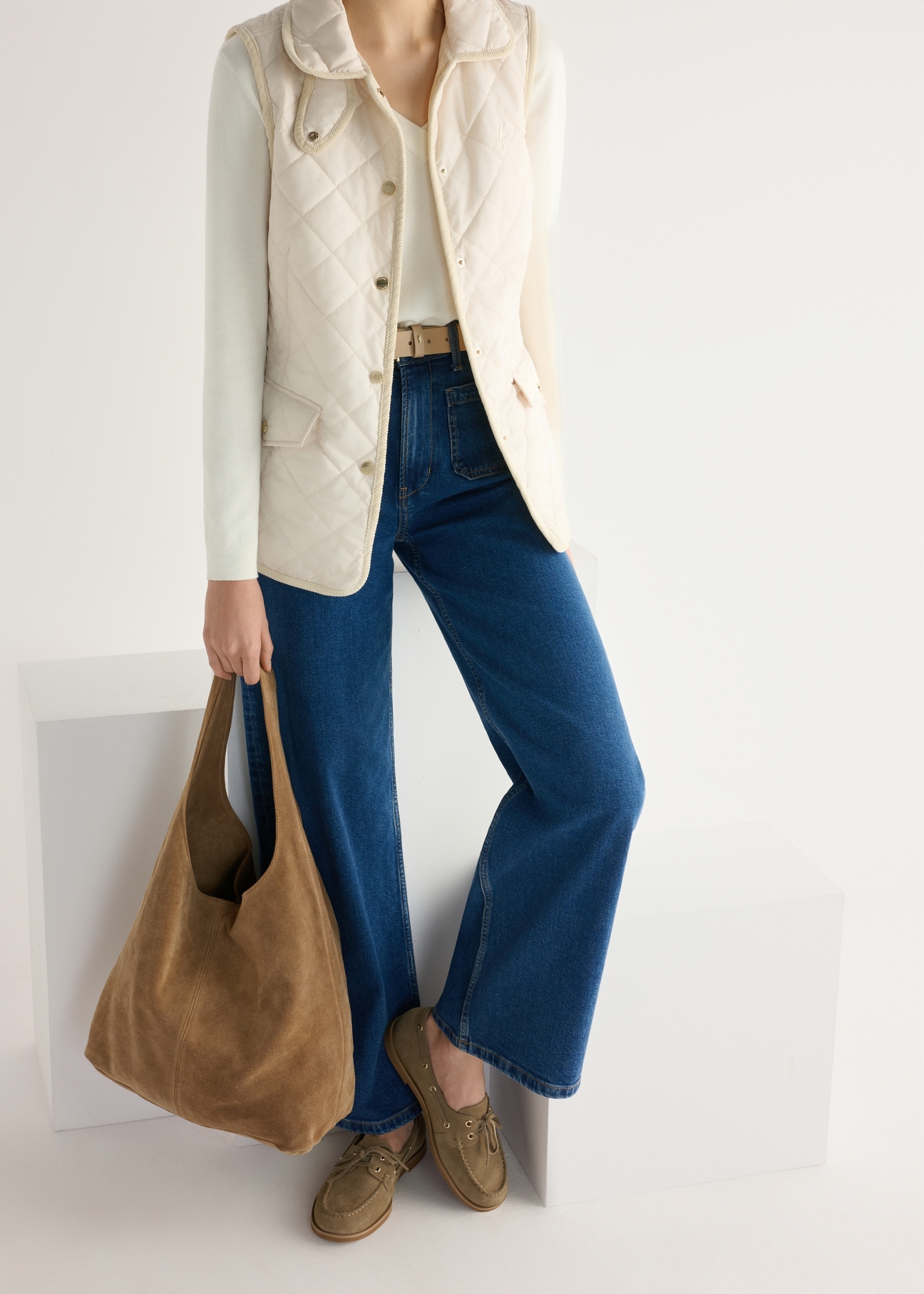 Women's leather moccasins in cool beige color BUTYD-1240-1K(W26), product view from the front on the model, half of the silhouette visible.