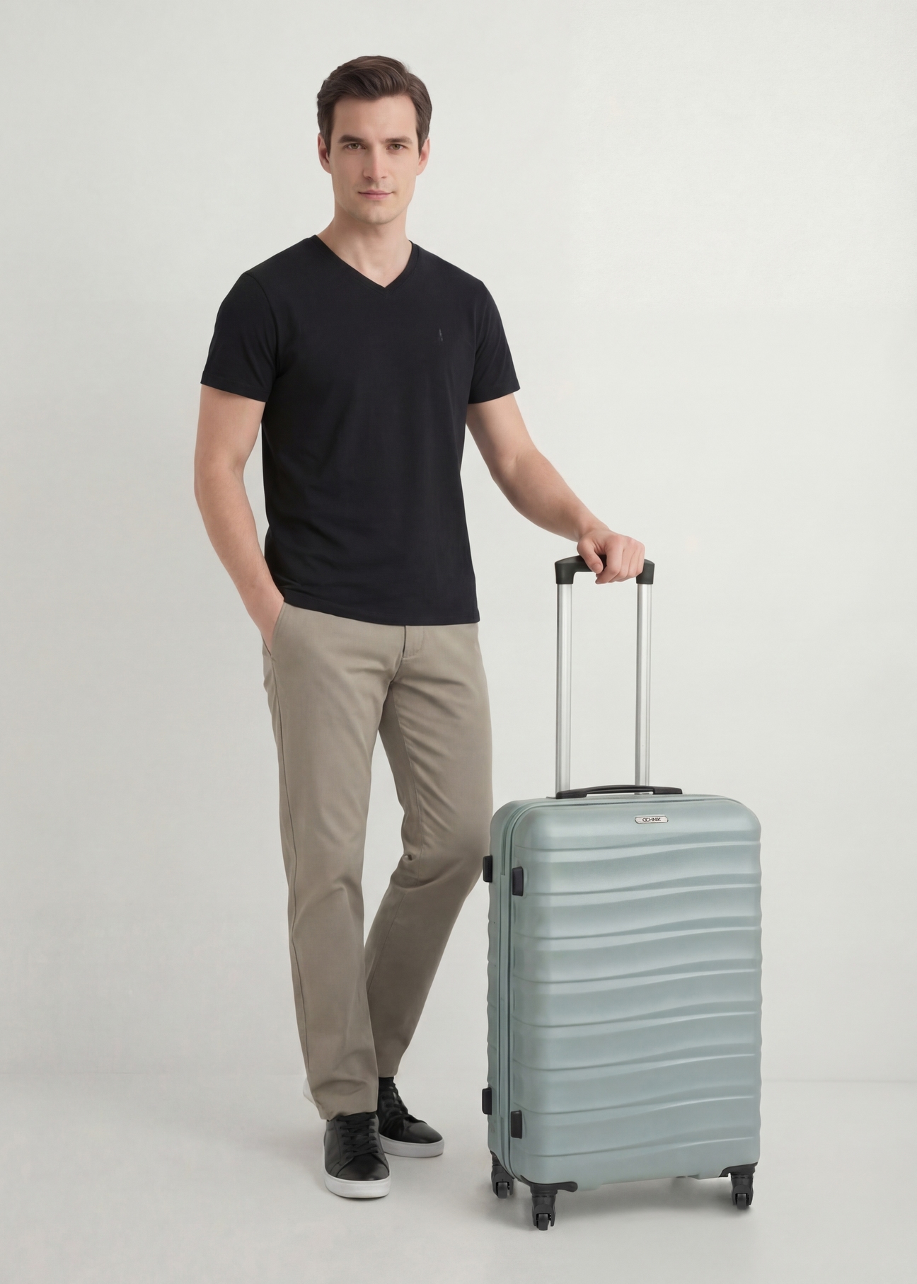 Medium suitcase on wheels WALAB-0081-8F-24(W26), diagonal view of the product next to the model's silhouette.