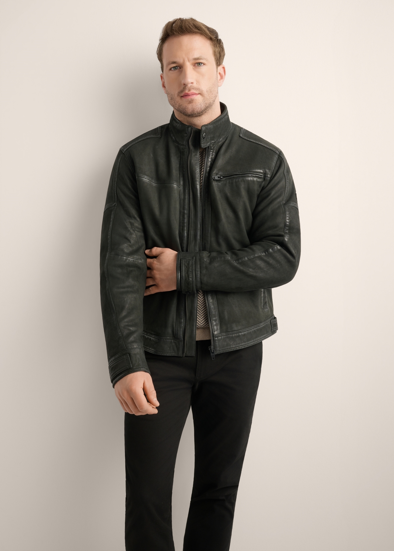 Black men's leather jacket KURMS-0420-99(Z26), front product view on model. Half silhouette visible.