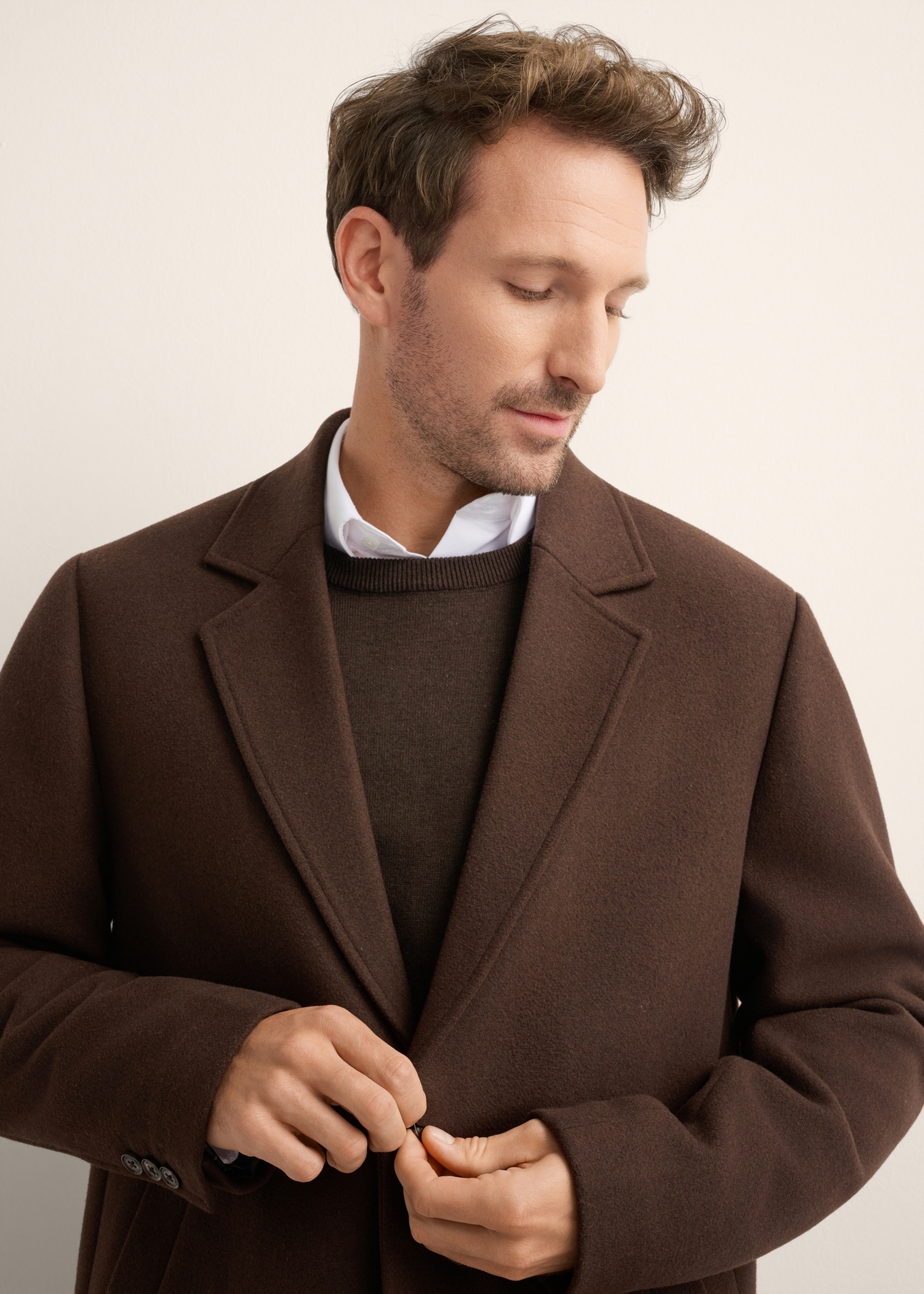 Men's brown wool coat PLAMT-0006-1I(Z26), front view of the product on the model. Half of the silhouette visible.