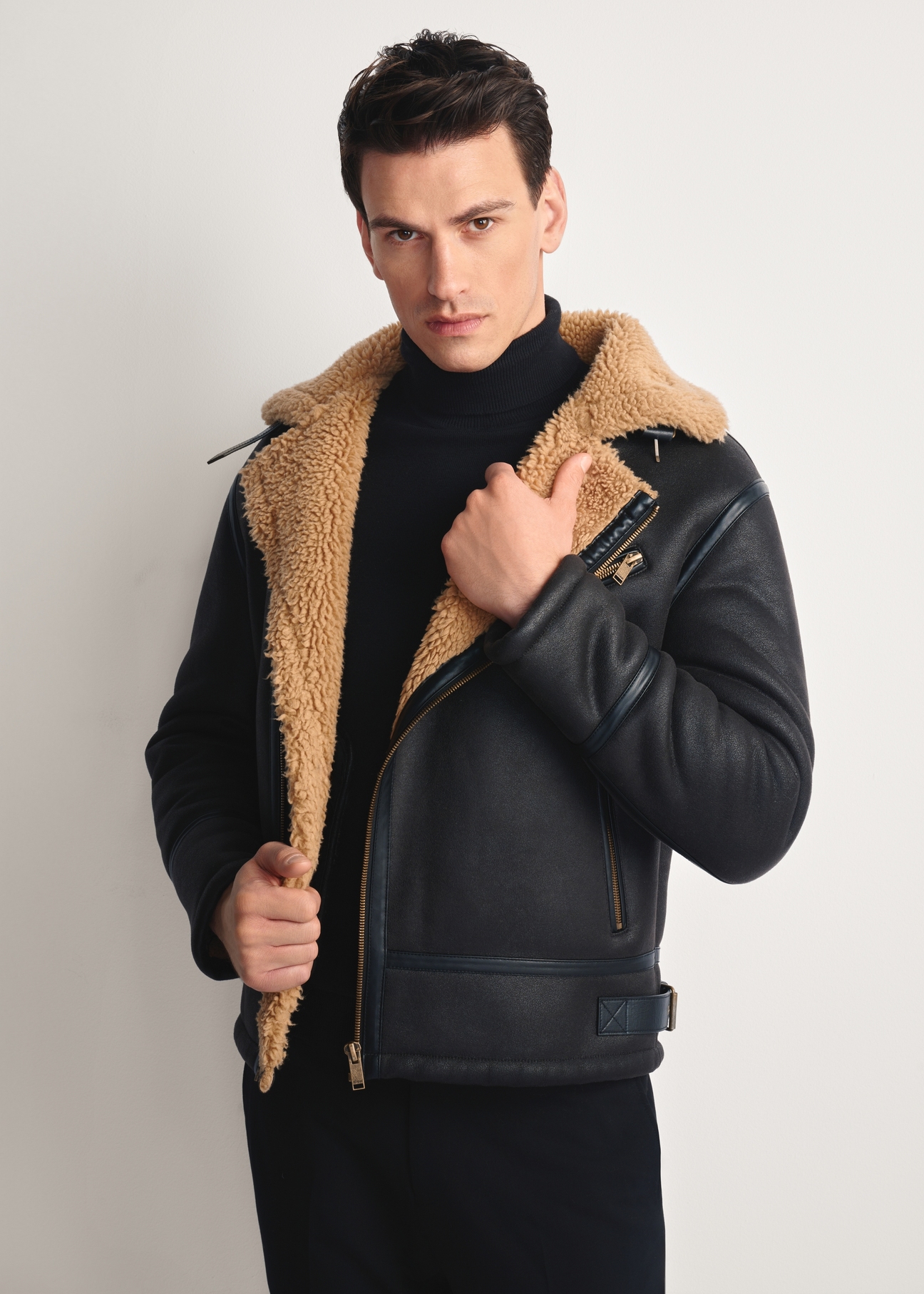 Dark brown men's sheepskin coat KOZMP-0002-90(Z25), front view of the product on the model, half of the silhouette visible.