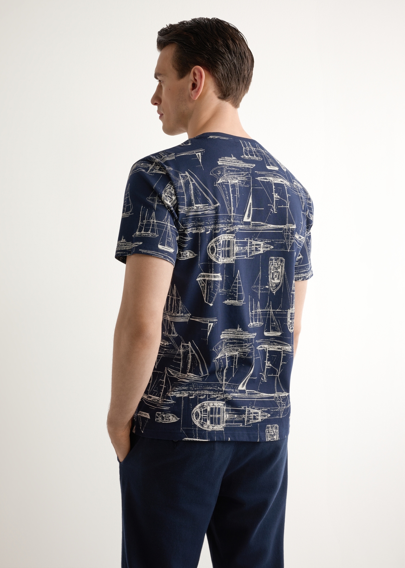 Men's navy graphic t-shirt TSHMT-0148-7E(W26), back view of the product on the model. Half of the silhouette visible.