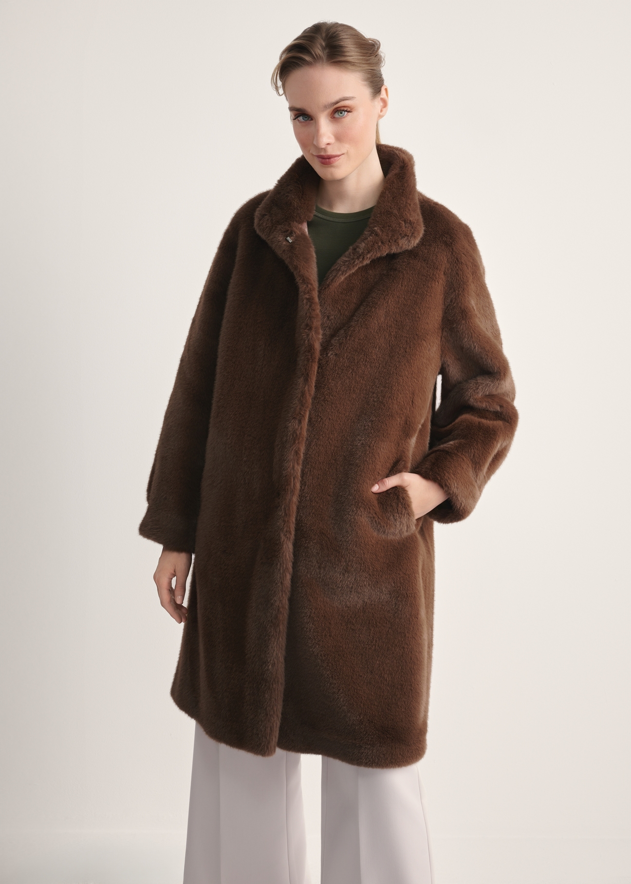 Elegant brown women's fur coat FUTDP-0050-89(Z25), front view of the product on the model, half of the silhouette visible.-02