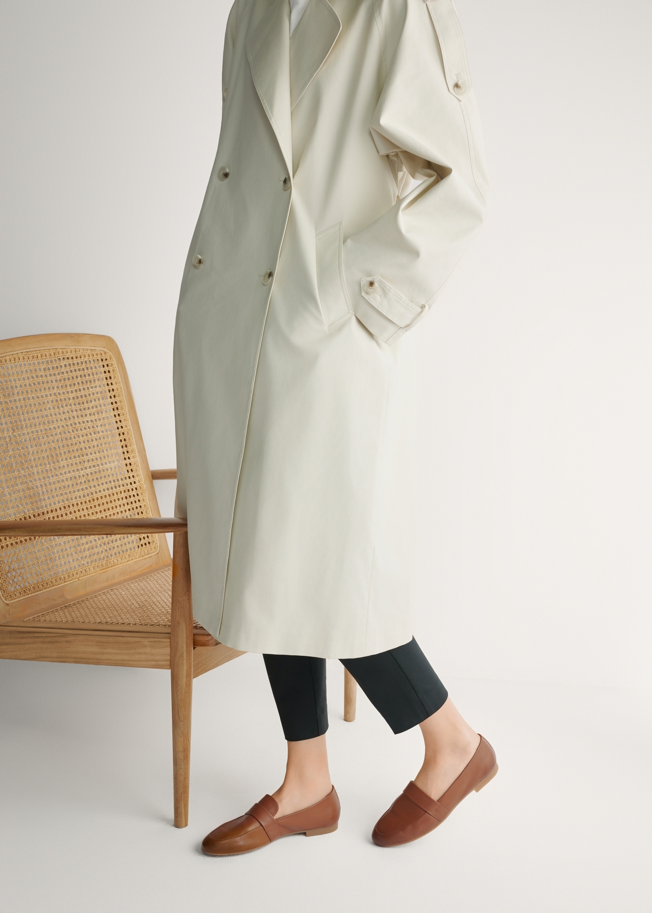 Women's leather moccasins in cognac color BUTYD-1074A-1F(W26), side view of the product on the model's feet.