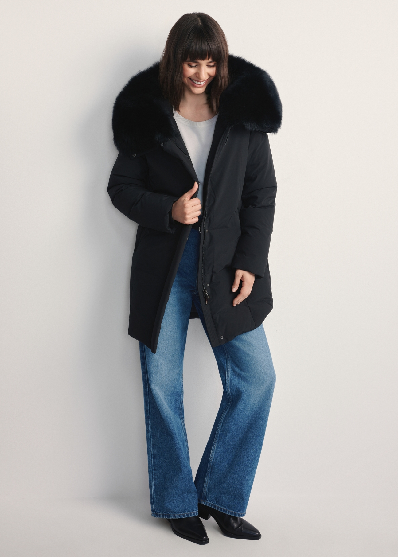 Women's black jacket with natural fox fur KURDT-0594-99(Z25) - front view of the product on a model against a white background. Full body visible.