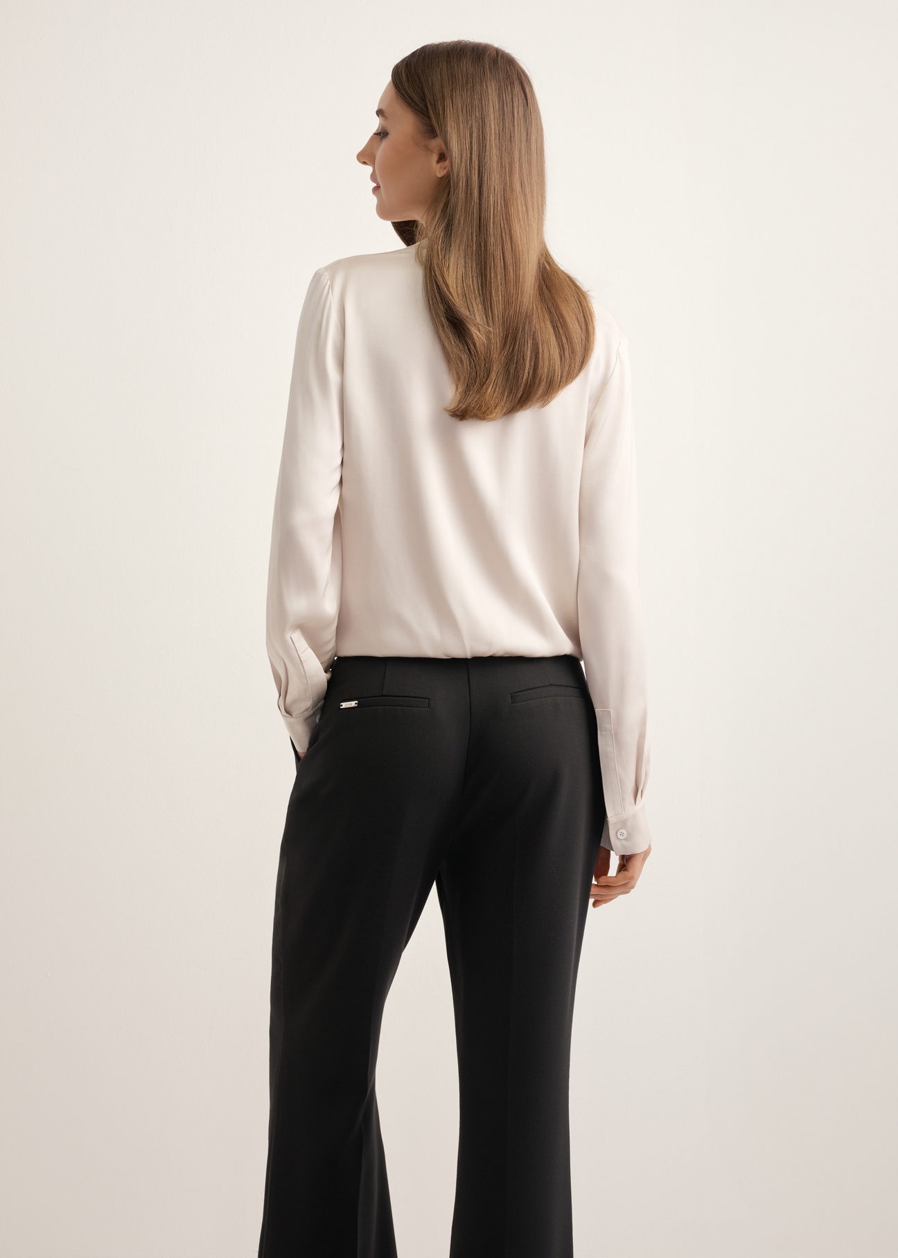 Cream women's viscose blouse BLUDT-0216-1A(Z26), back view of the product on the model, half of the silhouette visible.