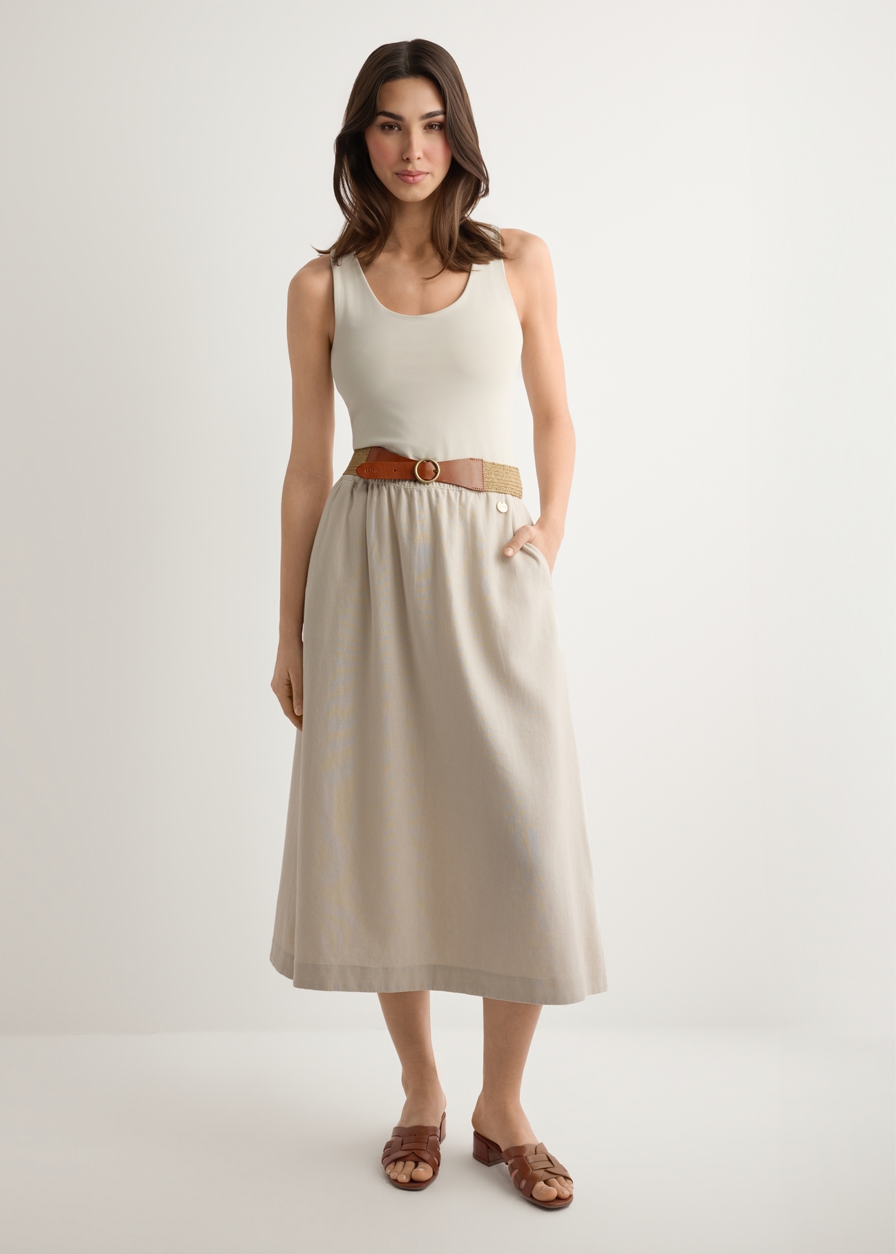 Beige viscose and linen skirt SPCDT-0124-1A(W26), front view of the product on the model. Full body visible.