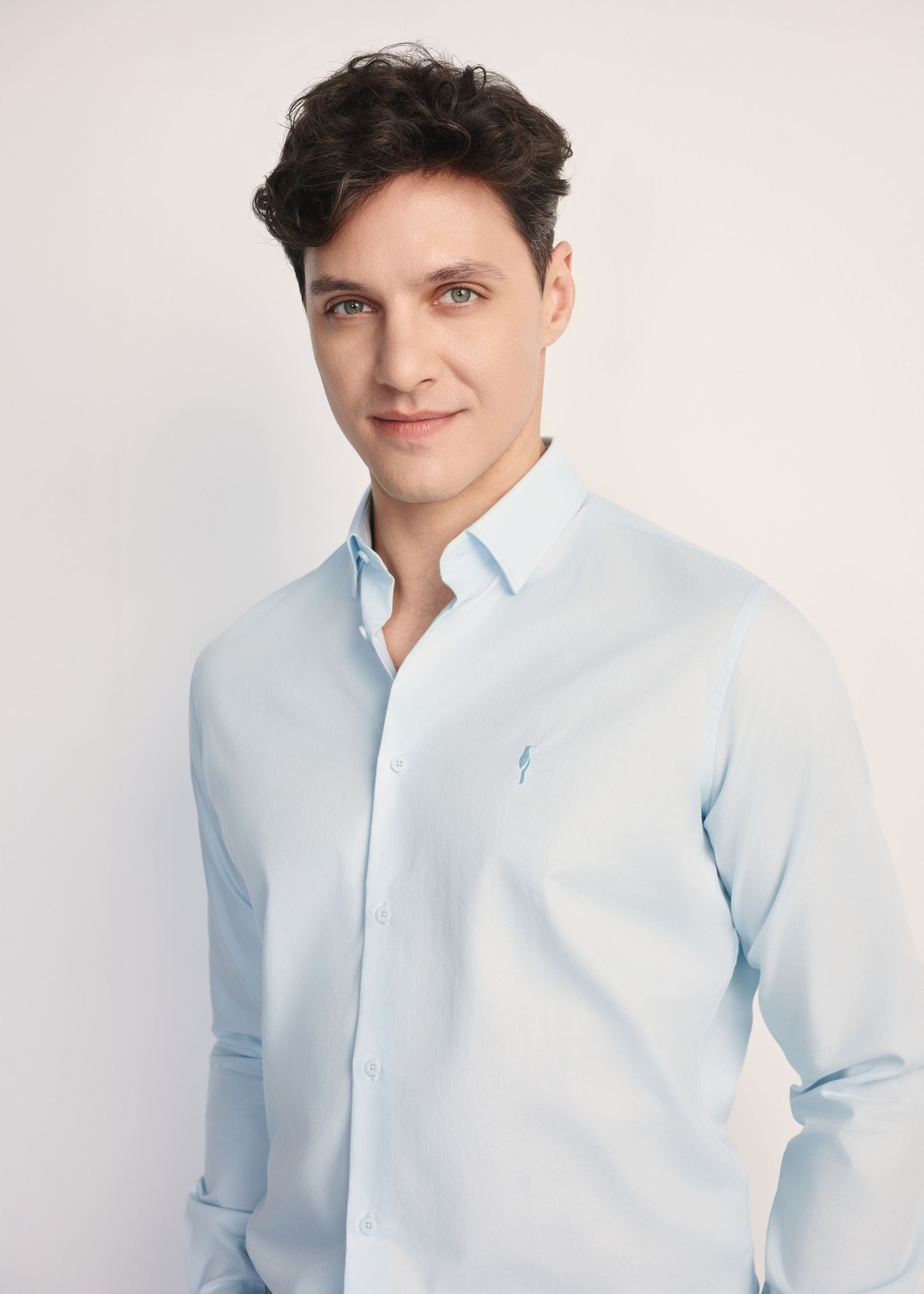 Blue men's shirt KOSMT-0351-62(Z25) - front view of the product on a model on a white background. Half of the silhouette visible.