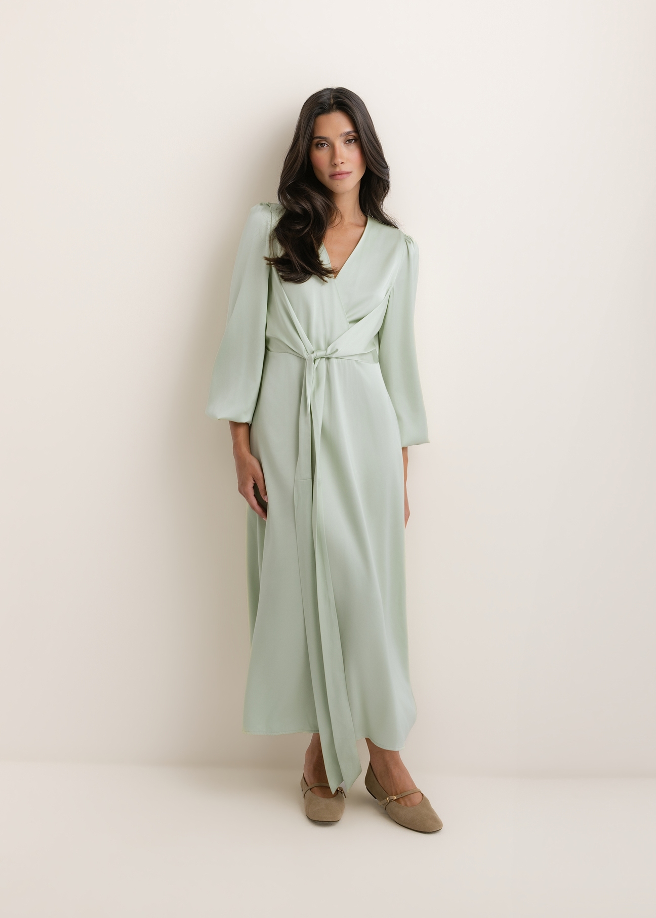Sage midi dress SUKDT-0263-8F(W26), front view of the product on the model. Full silhouette visible.