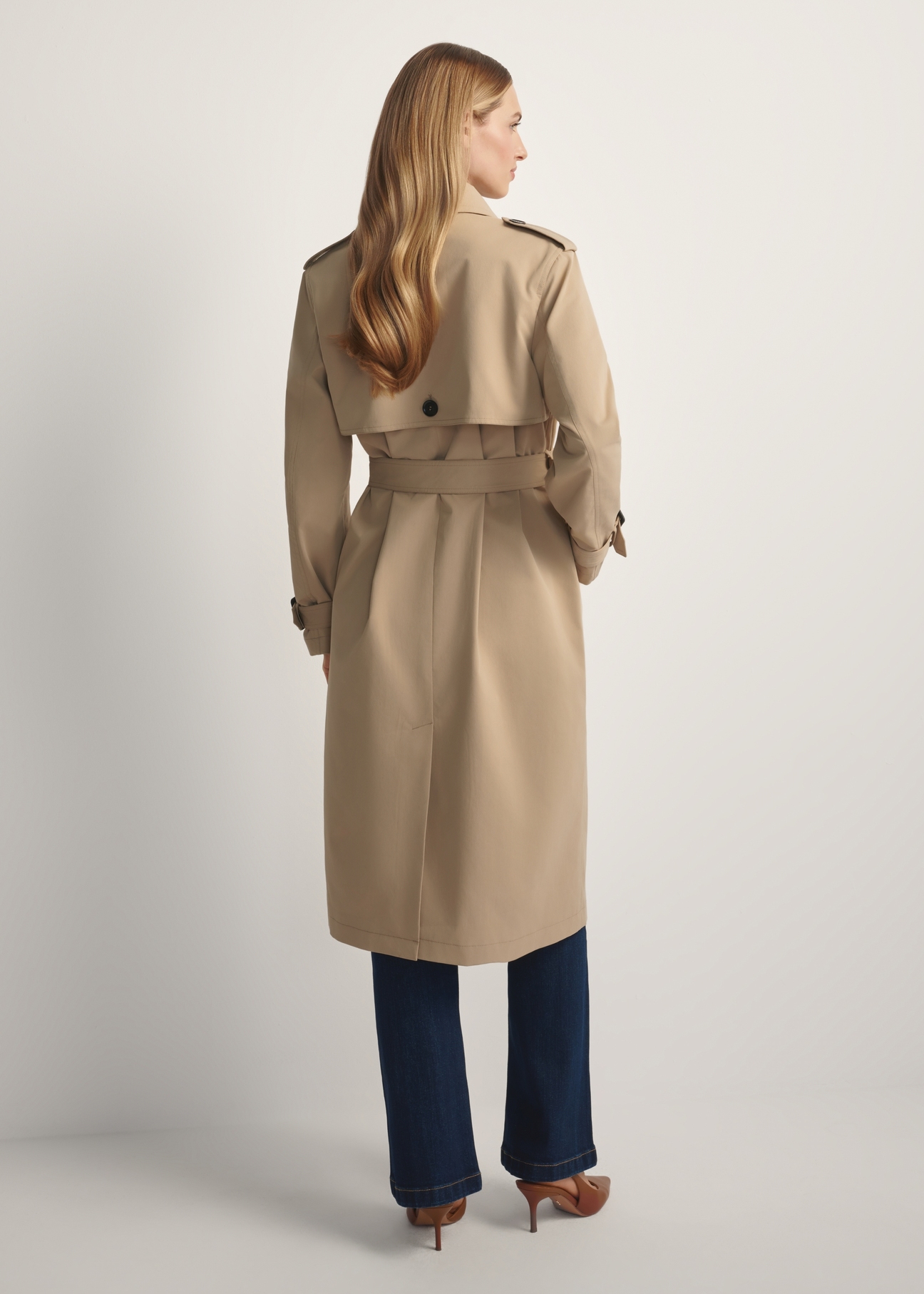 Long beige women's coat KURDT-0512-1C(W26), product view from the back on the model. Full body visible.