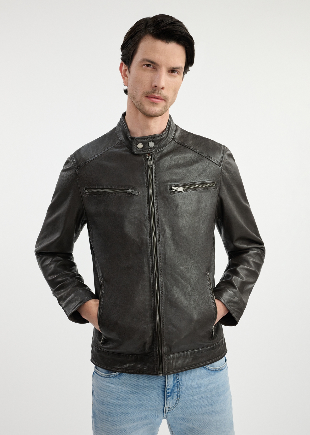 Dark brown men's leather jacket KURMS-0326-1364(W25) - front view on model on white background. Half of the silhouette visible.