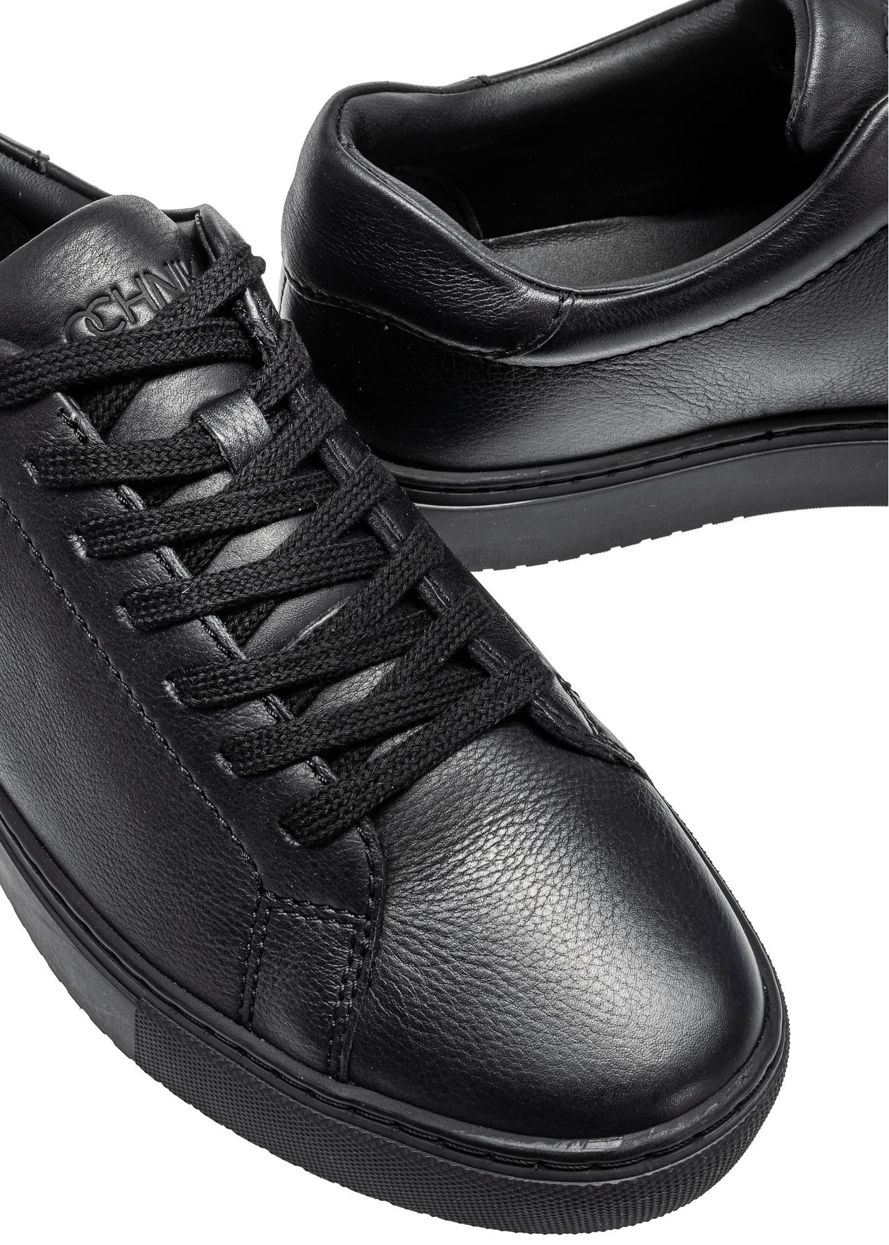 Black leather sports shoes BUTYM-0503A-99(W26), close-up of the product detail on a white background.