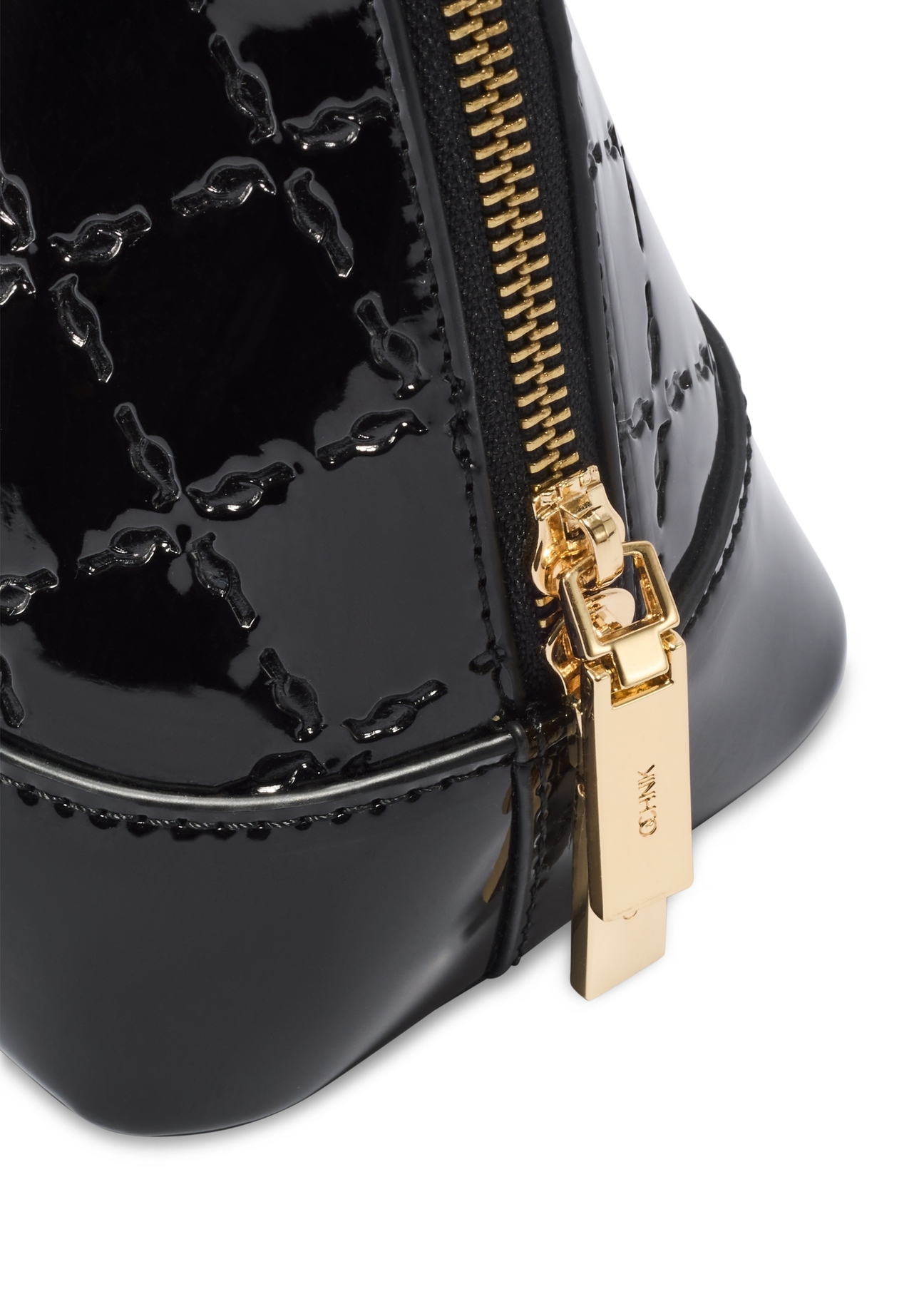 Black women's handbag with gloss TOREC-1110-99(Z25), close-up of the product zipper, view on a white background.