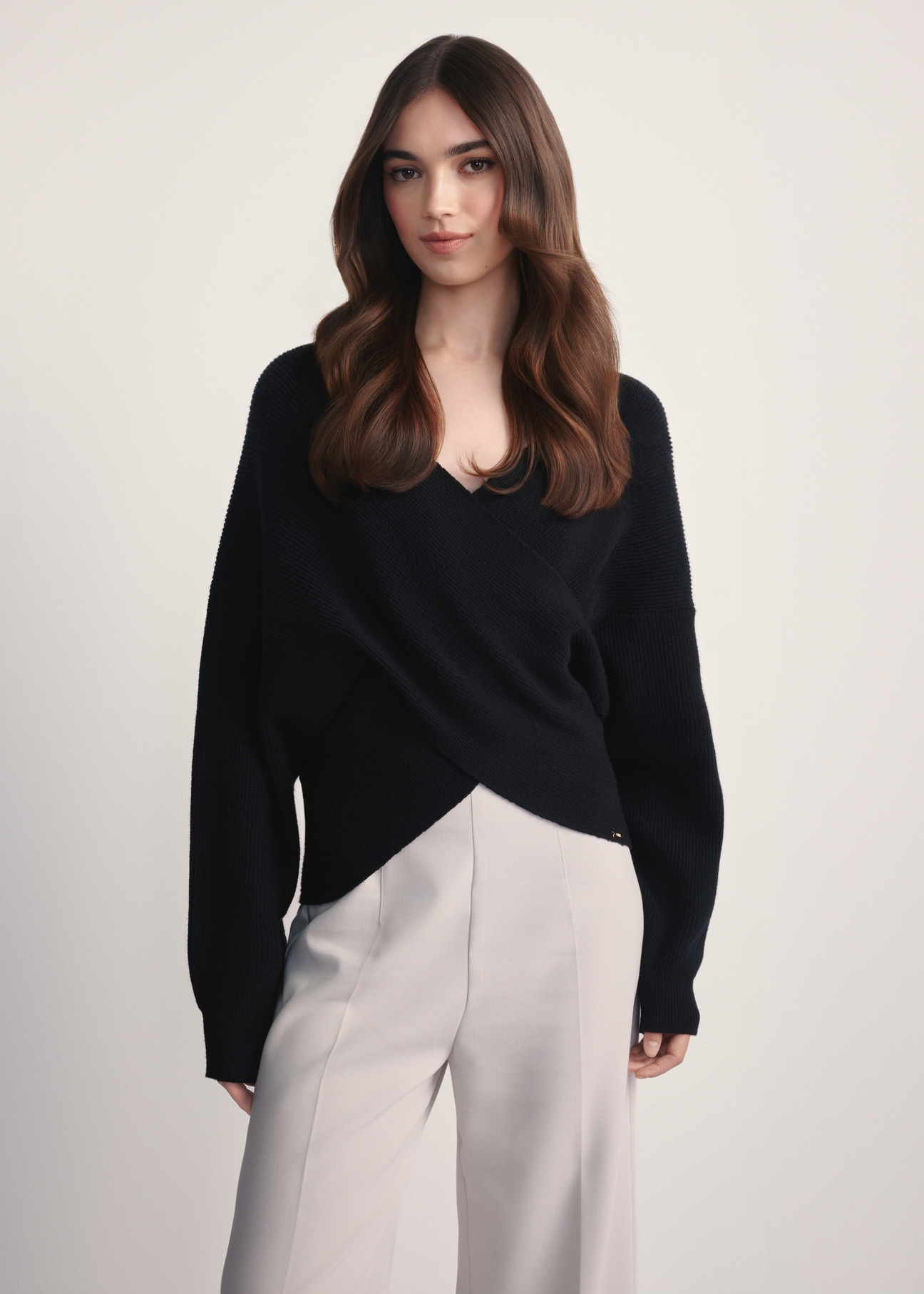 Black women's viscose sweater SWEDT-0240-99(Z25), front view of the product on the model. Half of the silhouette visible.