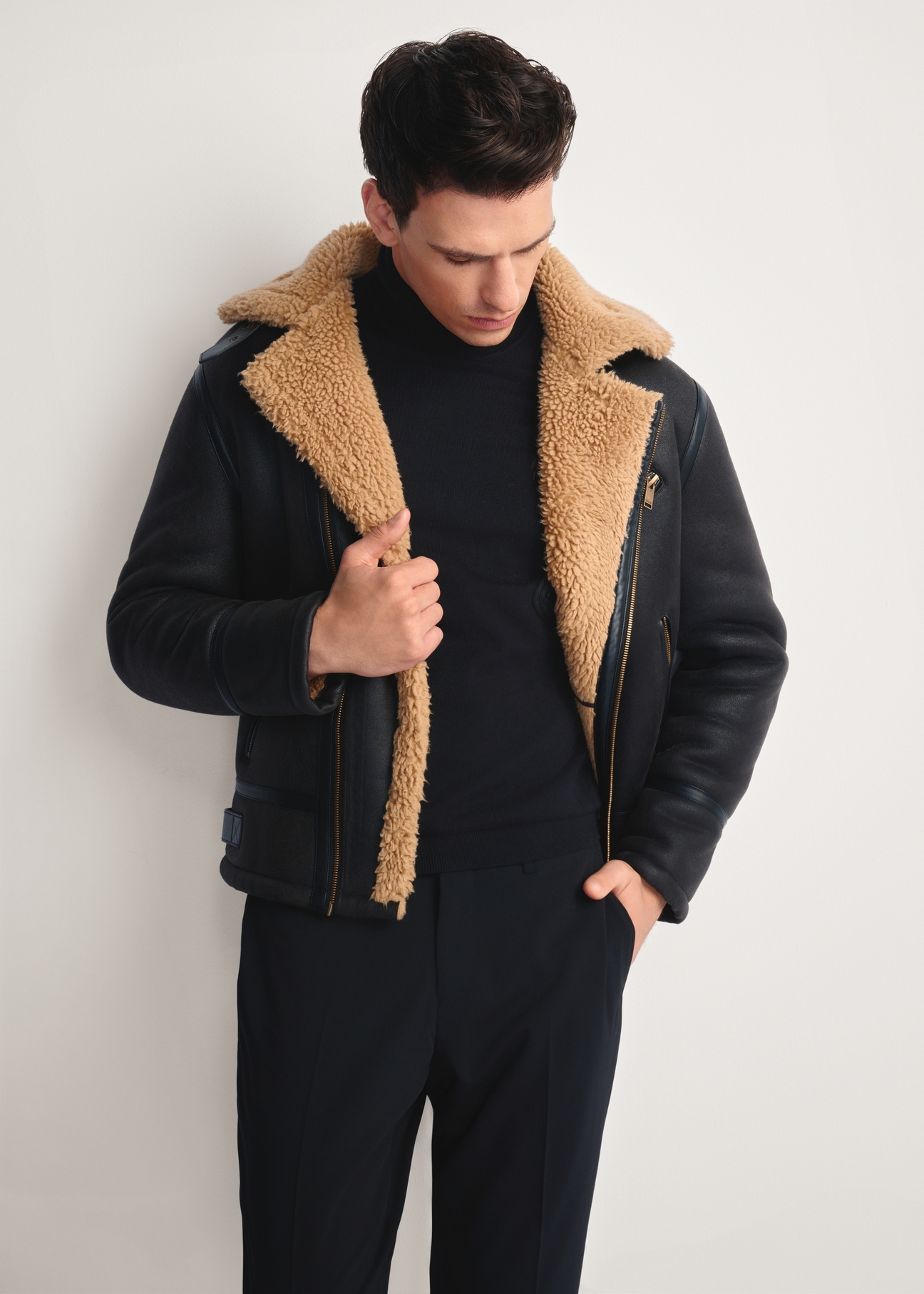 Dark brown men's sheepskin coat KOZMP-0002-90(Z25), front view of the product on the model, half of the silhouette visible.