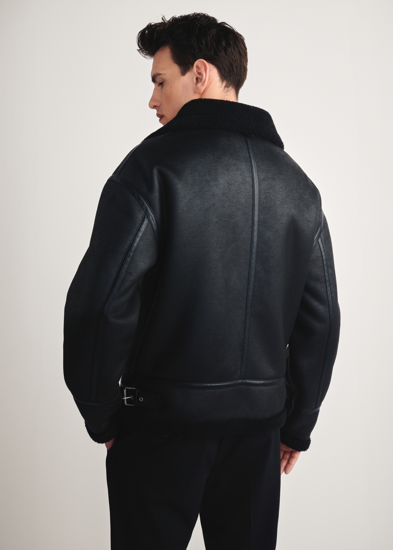 Men's black sheepskin coat KOZMP-0009-99(Z25) - rear view of the product on a white background. Half of the silhouette visible.