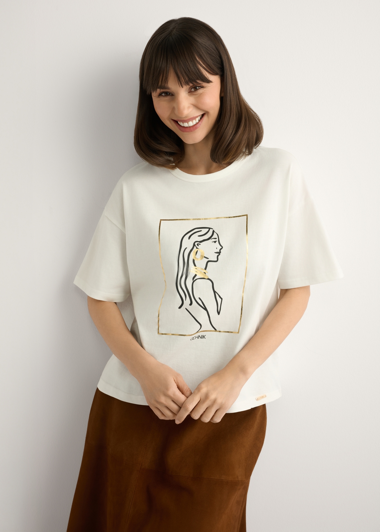 Women's white T-shirt with print TSHDT-0153-0B(W26), front view of the product on the model. Half of the silhouette visible.