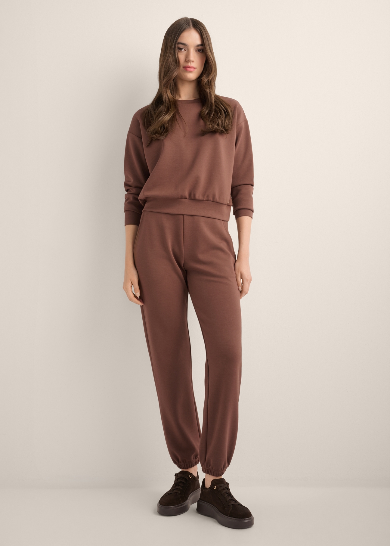 Brown women's sweatshirt BLZDT-0119-1H(Z26), front view of the product on the model. Full body visible.