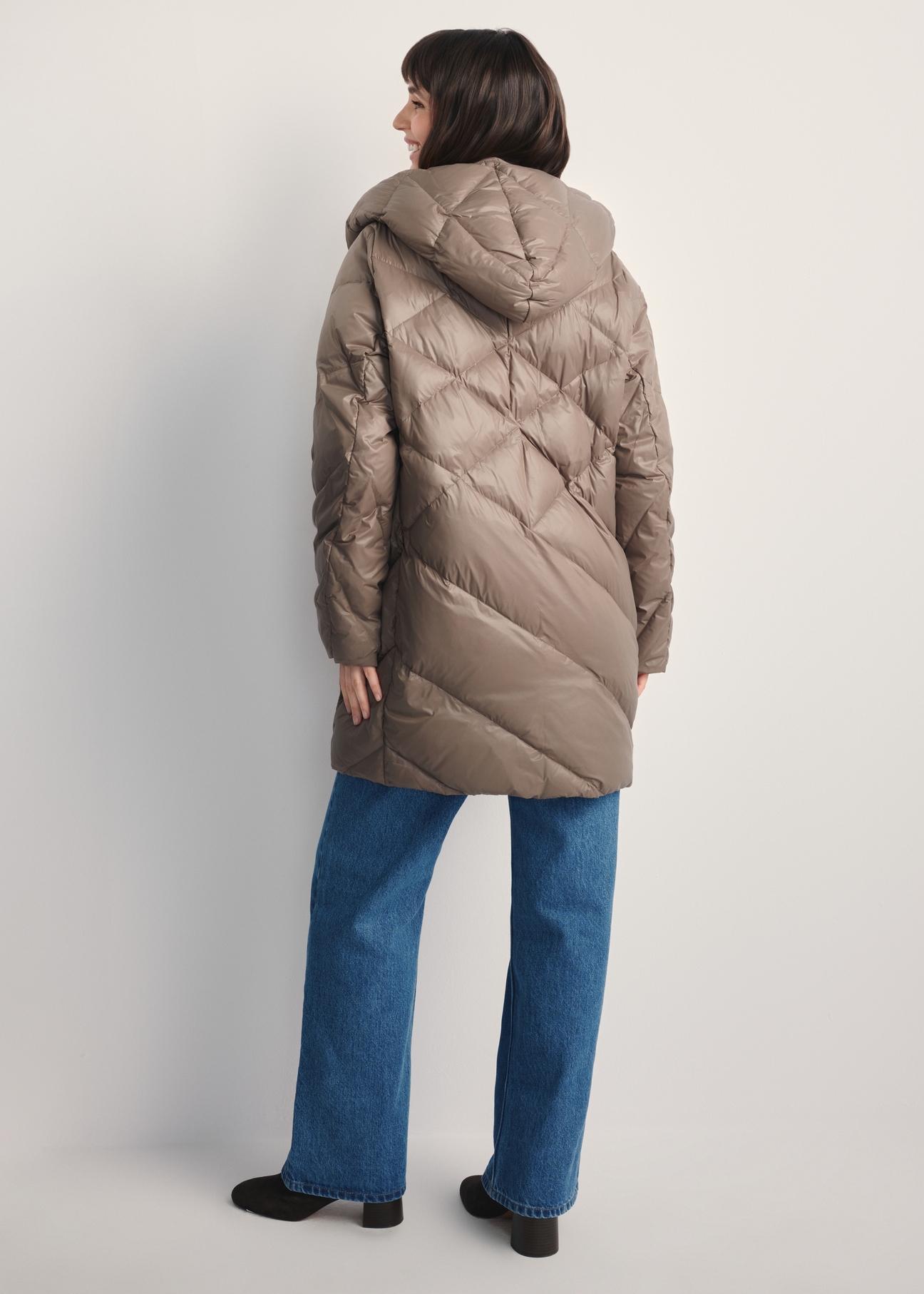 Women's olive quilted jacket KURDT-0595-57(Z25), back view of the product on the model. Full body visible.