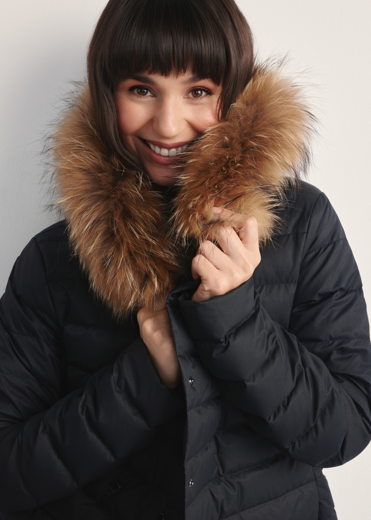Black women's winter jacket KURDT-0617-99(Z25) - close-up of detail on model against white background.