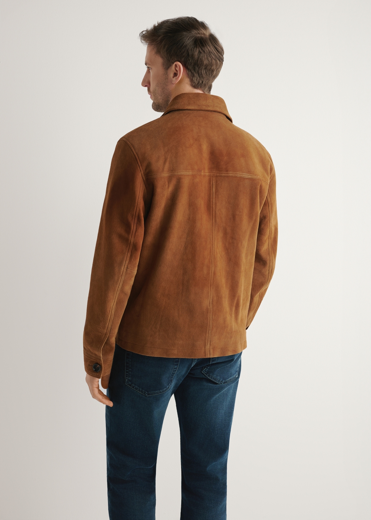 Men's cognac suede jacket KURMS-0401-1F(W26) - back view of the product, on a model, against a light background. Half of the silhouette visible.