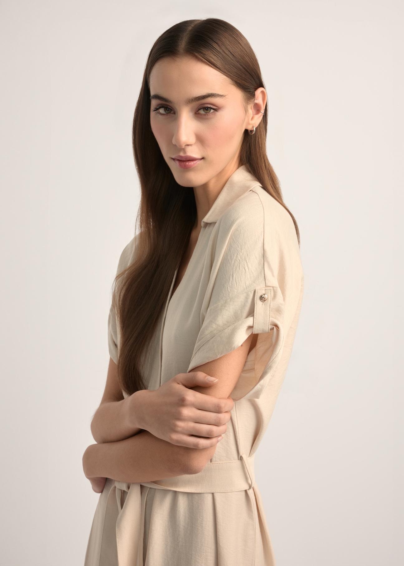 Light beige long dress with short sleeves SUKDT-0180A-1A(W26), side view of the product on the model. Half of the silhouette visible.