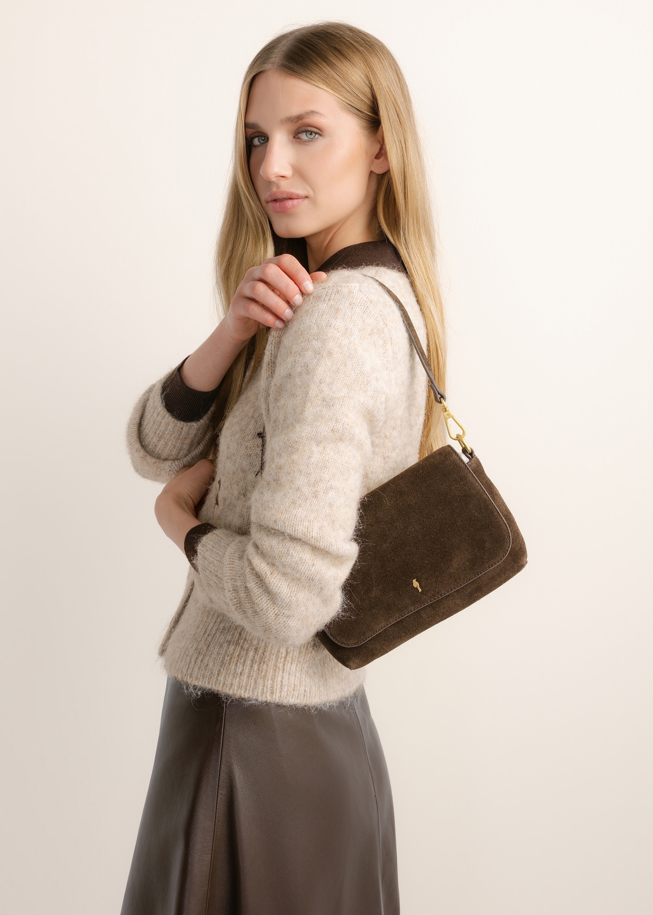 Women's brown suede messenger bag TORES-1388-1I(Z26), front view of the product on the model's shoulder.