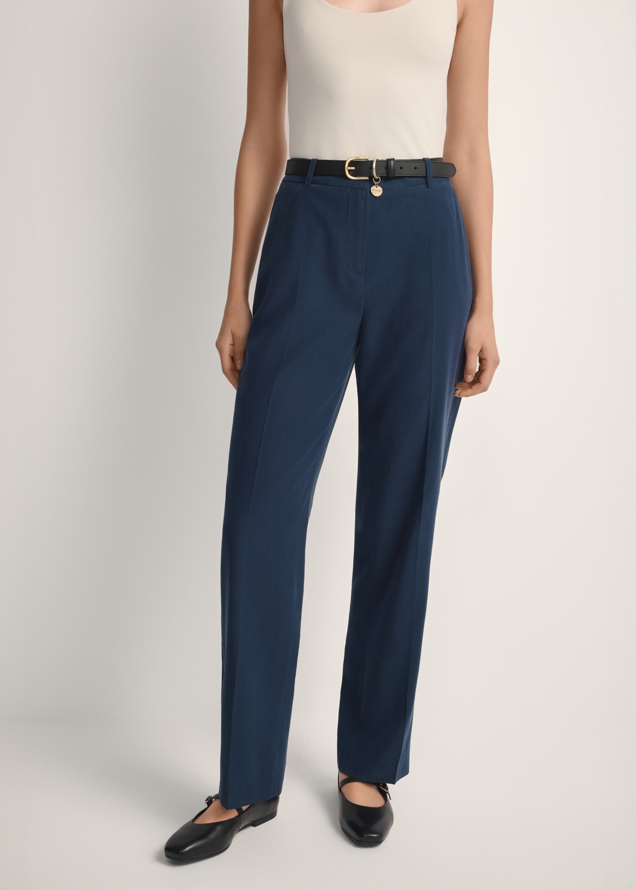 Navy blue elegant women's trousers SPODT-0106A-7E(W26), product view from the front on the model, half of the silhouette visible.