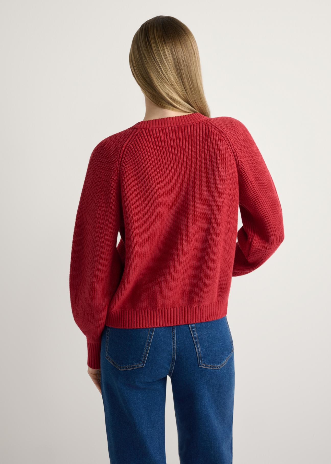 Red women's cardigan KARDT-0062-4B(W26), back view of the product on the model. Half of the silhouette visible.
