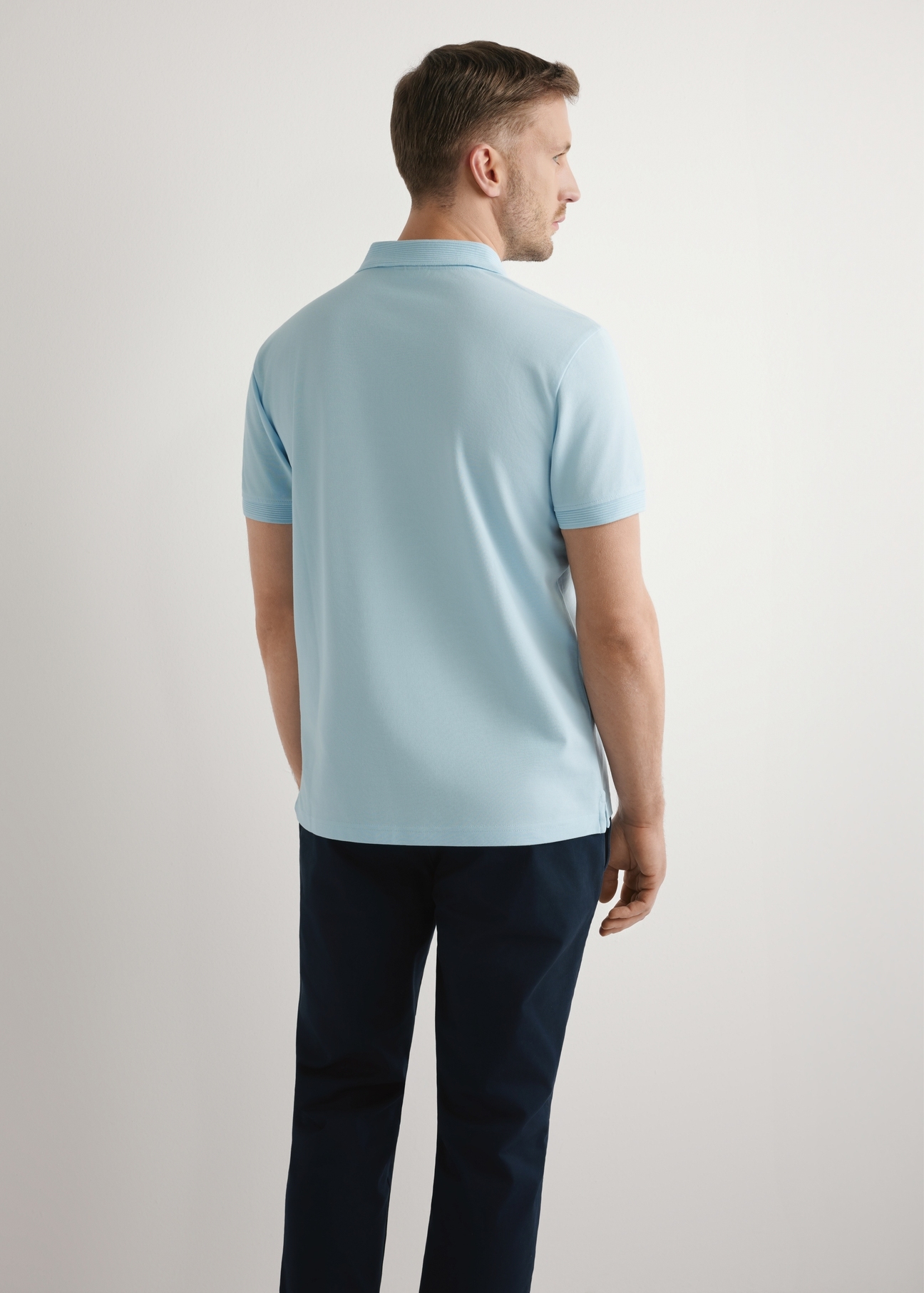 Men's light blue polo shirt POLMT-0089-7A(W26), back view of the product on the model. Half of the silhouette visible.