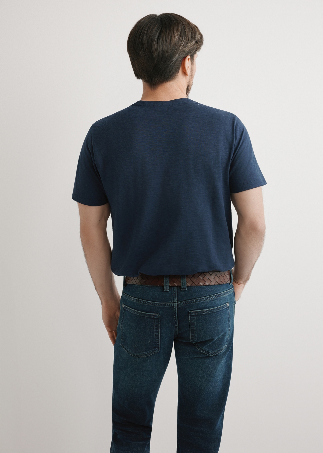 Men's navy blue cotton T-shirt TSHMT-0149-7E(W26), back view of the product on the model. Half of the silhouette visible.