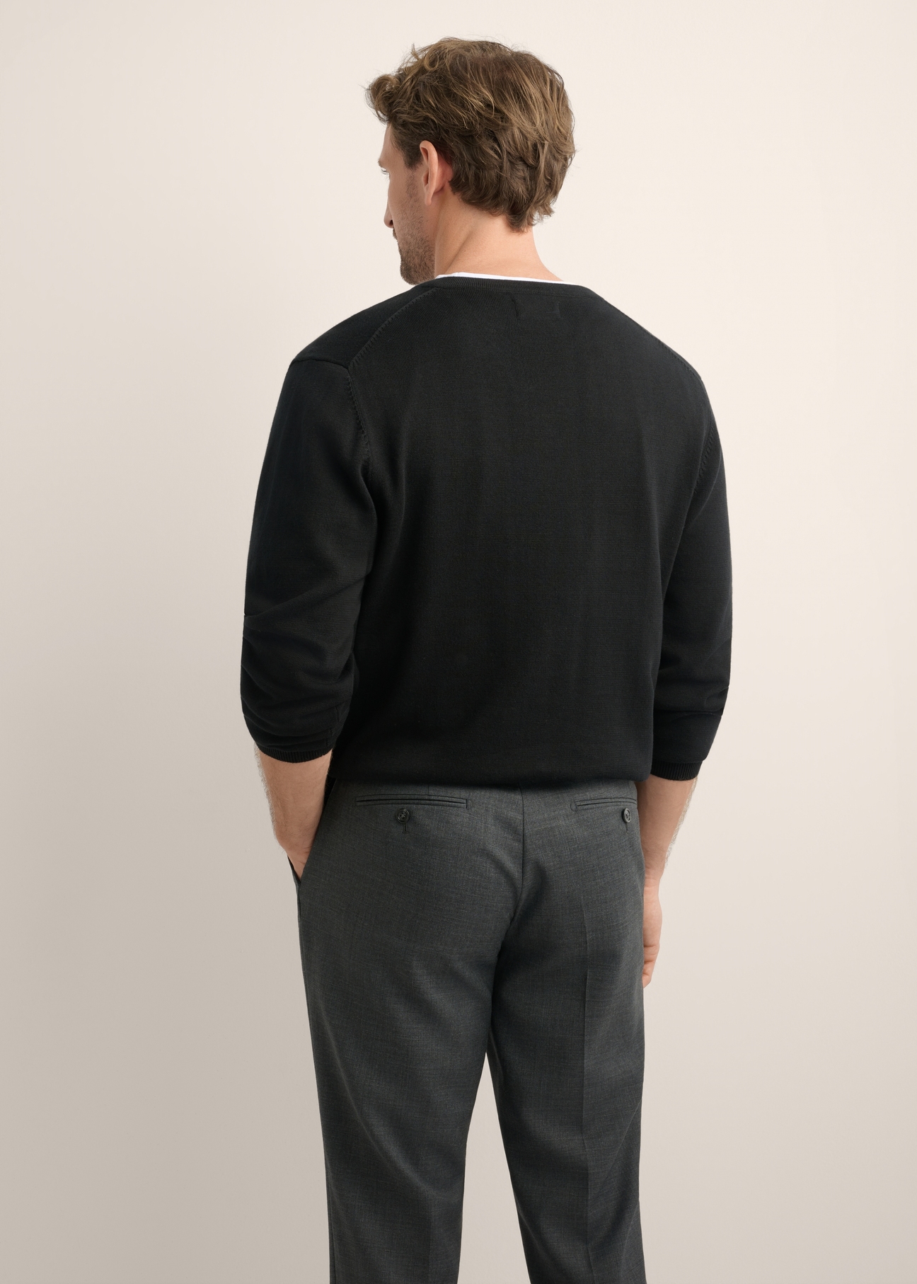 Black men's sweater with logo SWEMT-0159A-99(Z26), back view of the product on the model. Half of the silhouette visible.