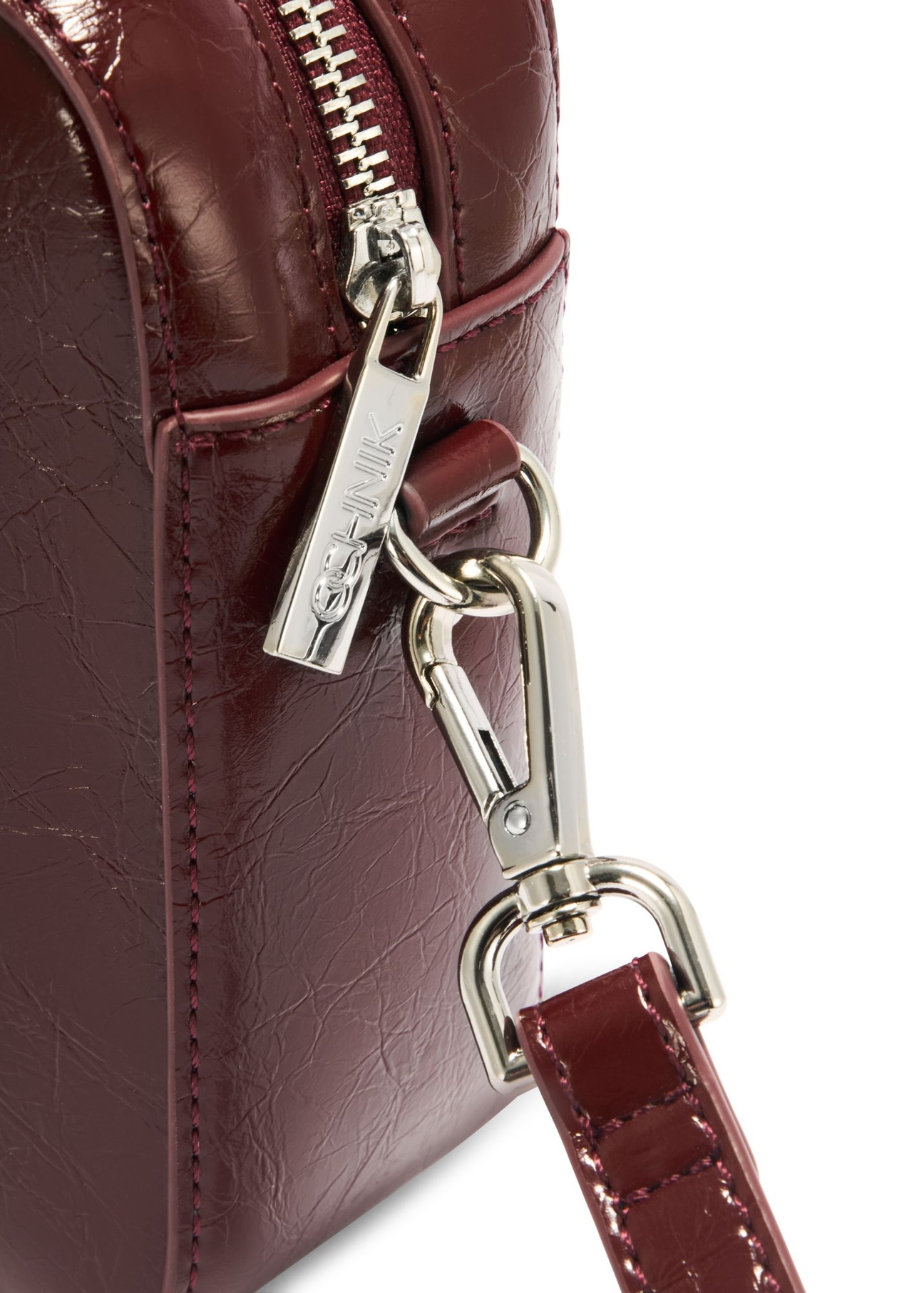 Burgundy women's handbag TOREC-0003J-49(Z25) - close-up of the detail on a white background.