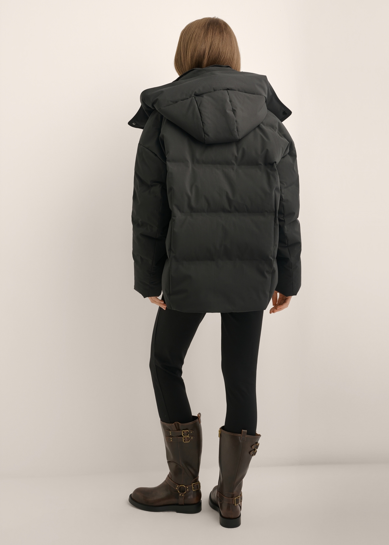Women's jacket with natural fill KURDT-0702-99(Z26), back view of the product on a model. Full body visible.