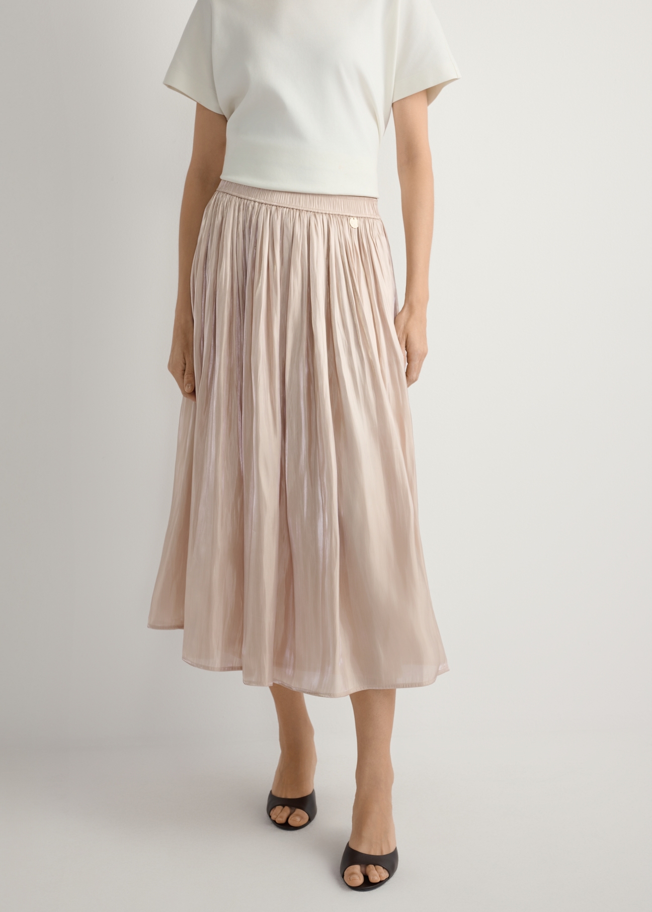 Women's shiny midi skirt SPCDT-0130-1B(W26), front view of the product on the model. Half of the silhouette visible.