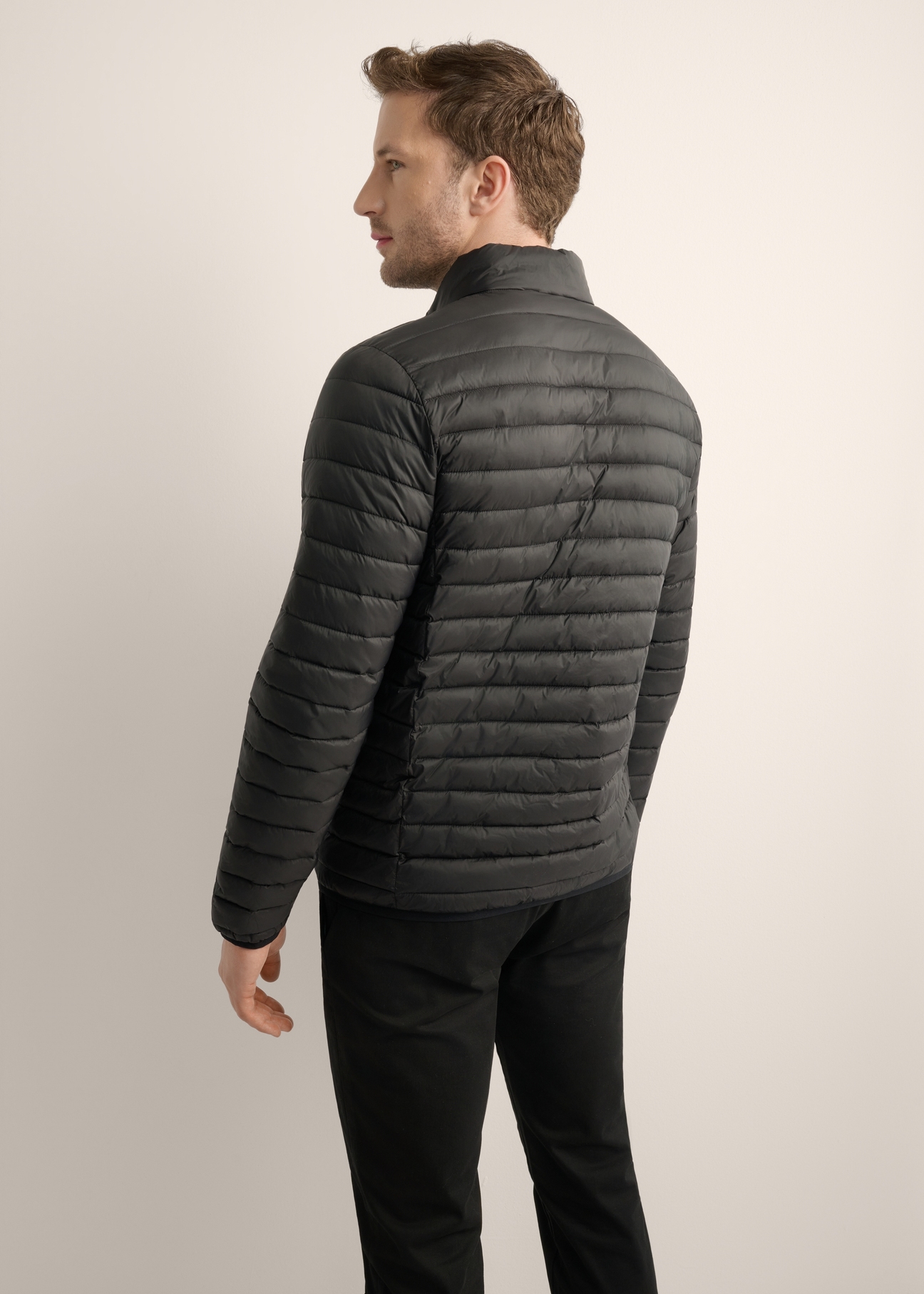 Black men's transitional jacket KURMT-0382-99(Z25), product view from the back on the model. Half of the silhouette visible.