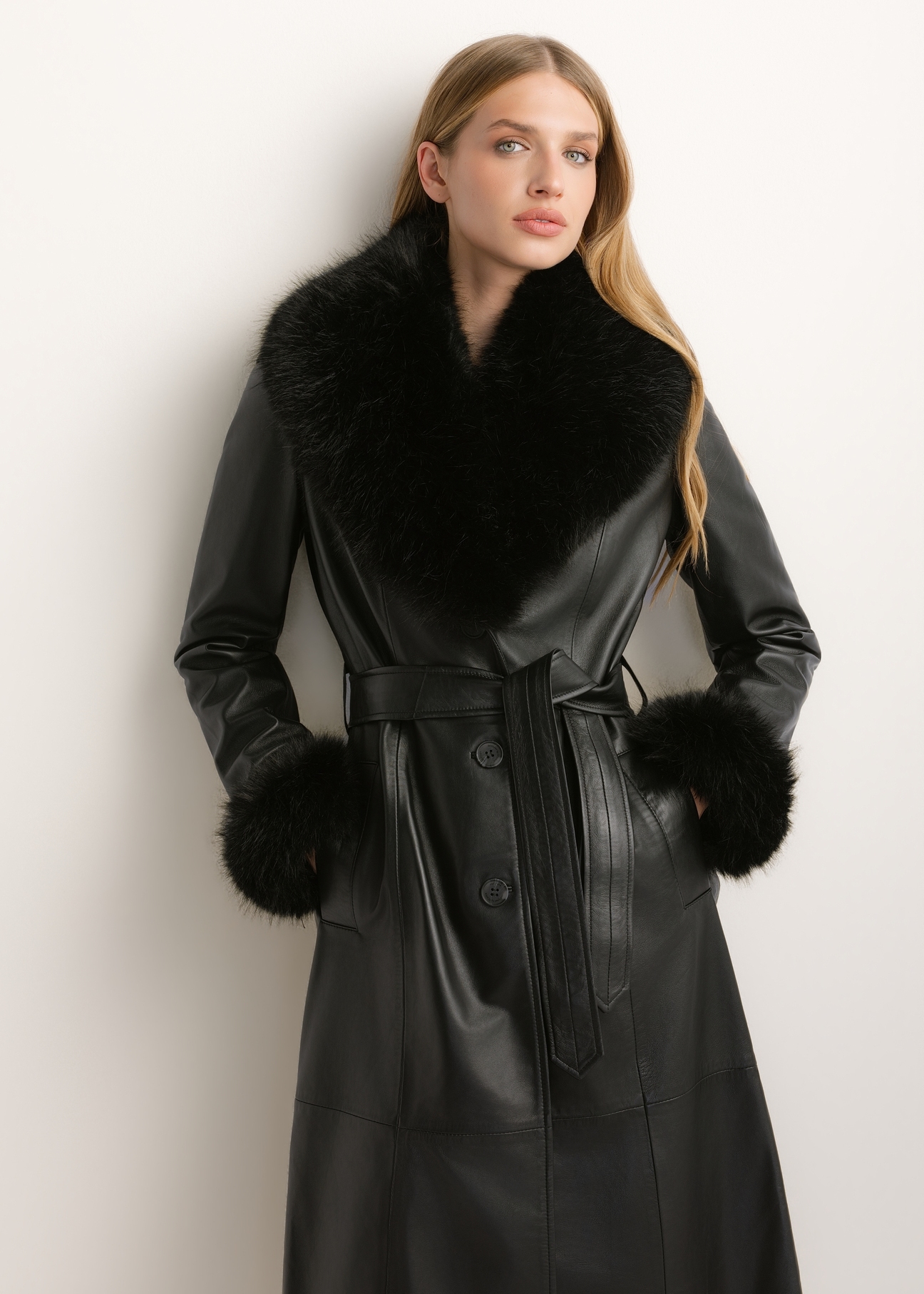 Women's black leather coat KURDS-0617-99(Z26), front view of the product on a model. Half of the silhouette visible.