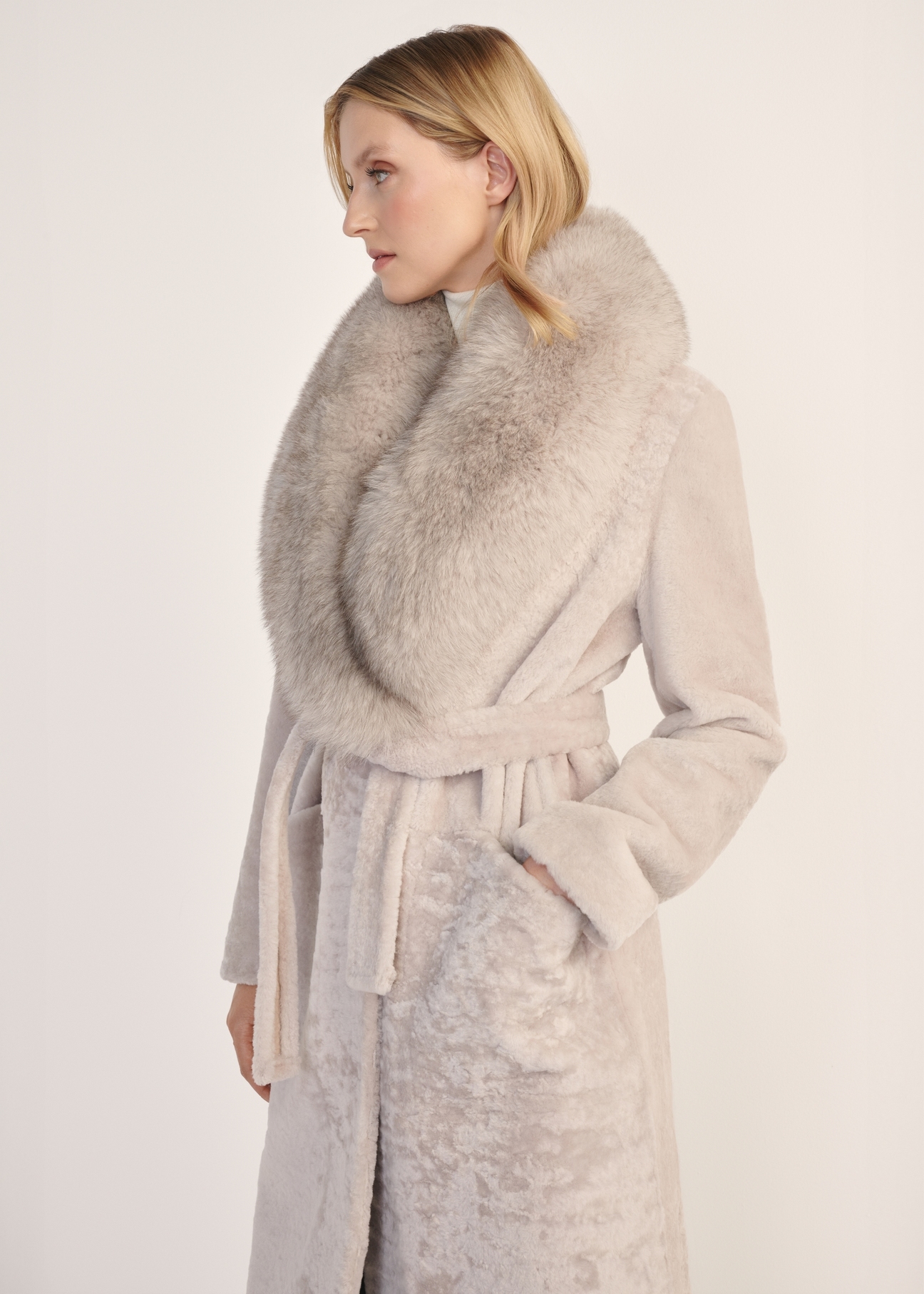 Light beige double-sided long women's sheepskin coat KOZDS-0089-3037(Z25) - front product view on white background. Half silhouette visible.