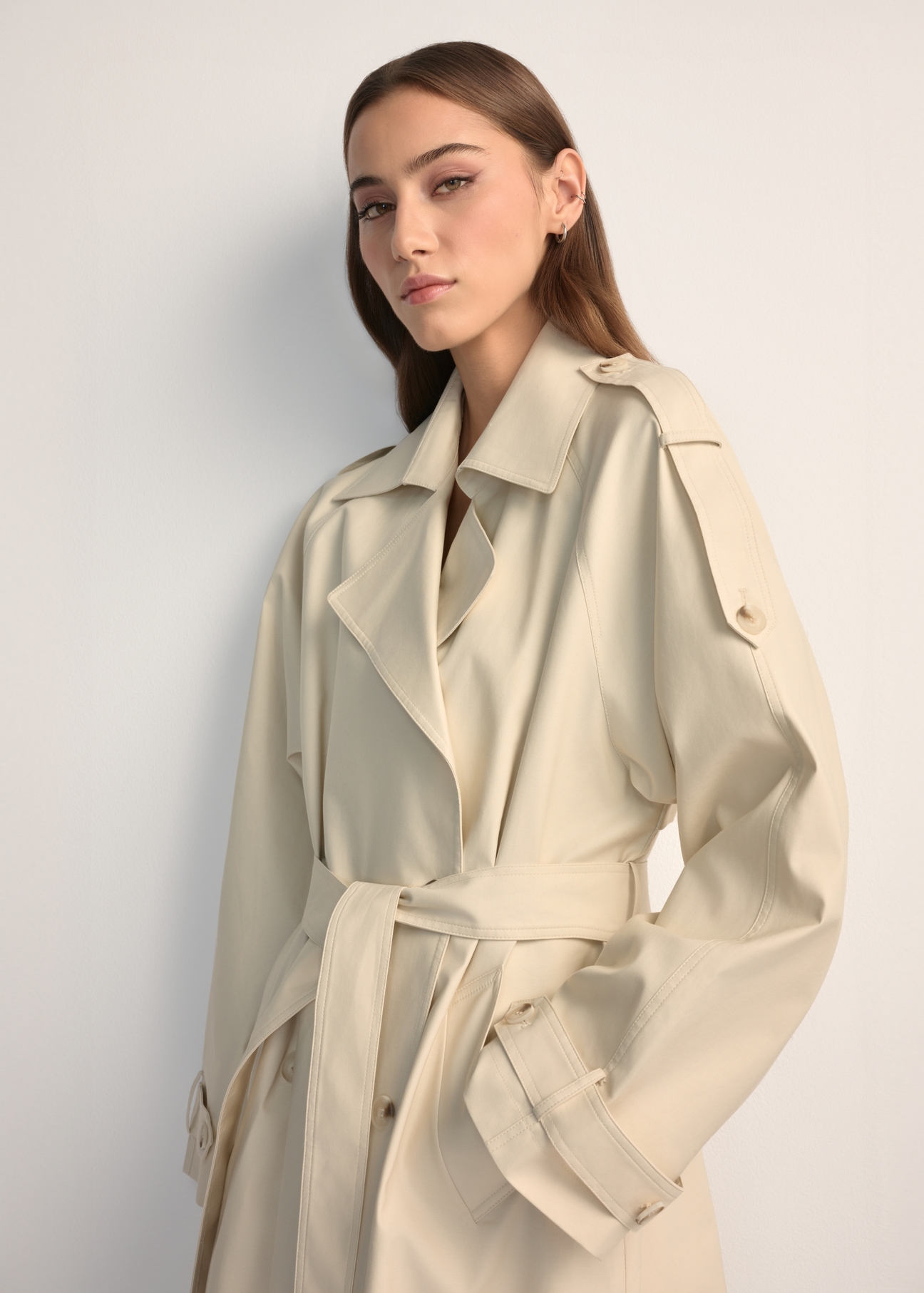 Long cream oversize women's coat KURDT-0659-0C(W26) - front view of the product, on a model, against a light background. Half of the silhouette visible.