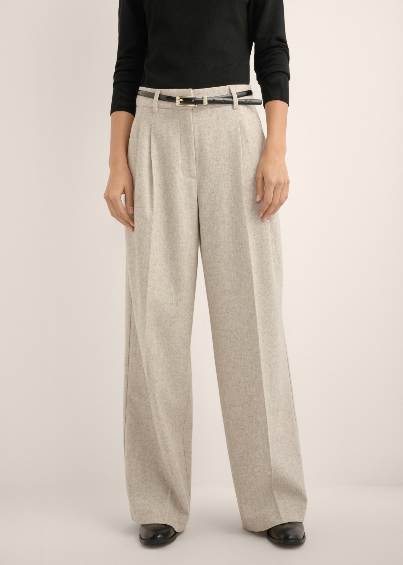Light beige women's wool trousers SPODT-0133-1A(Z26), front view of the product on the model. Half of the silhouette visible.