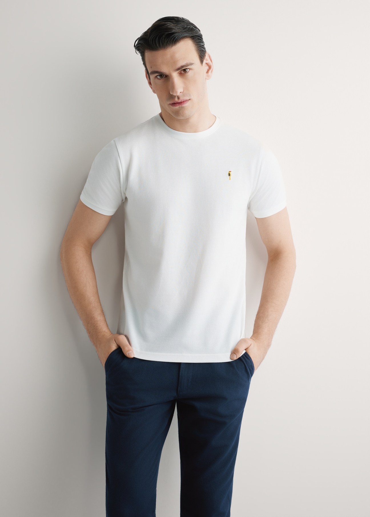 Men's cream cotton t-shirt TSHMT-0136-0B(W26), front view of the product on the model. Half of the silhouette visible.