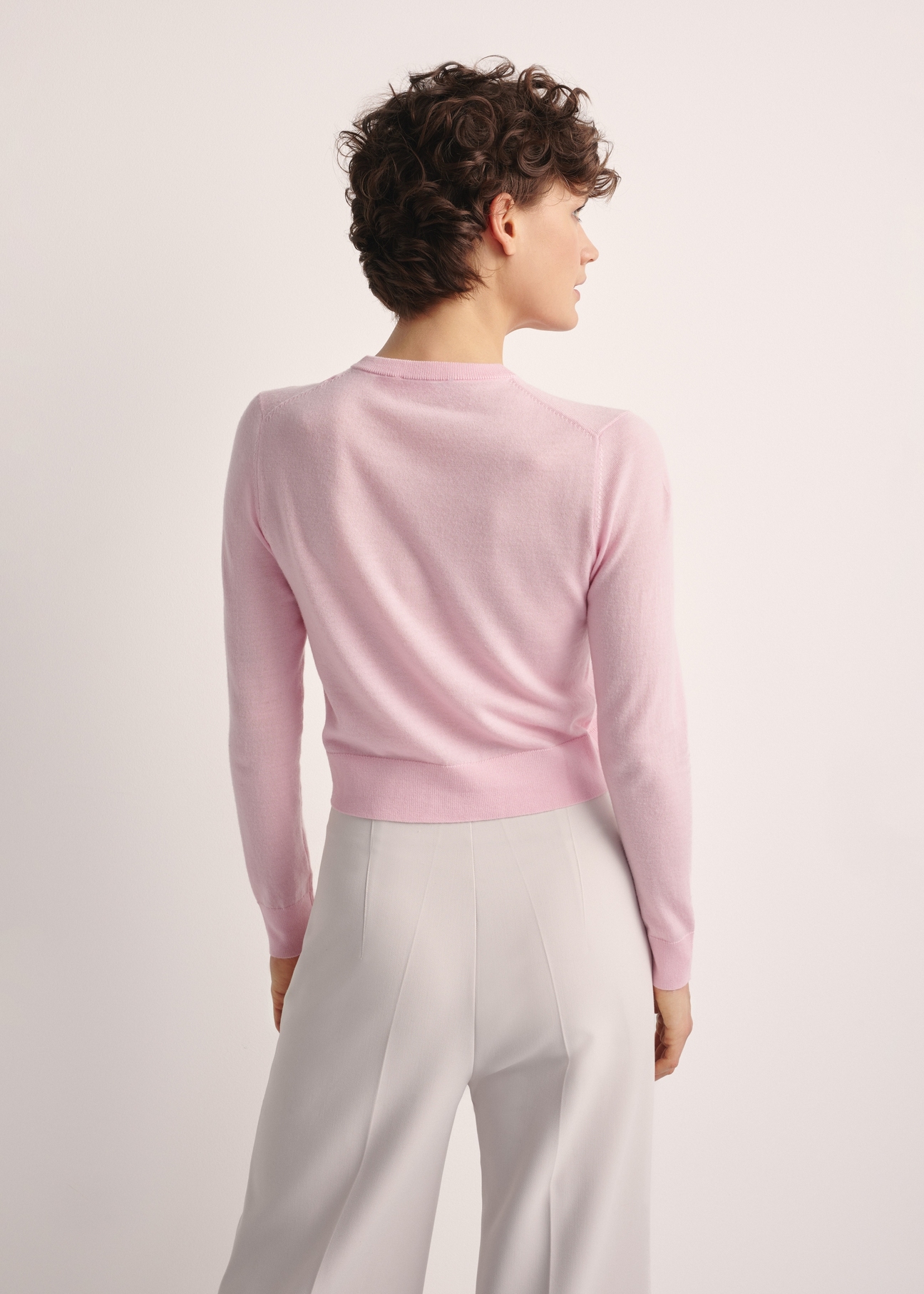 Women's woolen cardigan KARDT-0057-34(Z25), product photo from the back on a model, half of the silhouette visible.